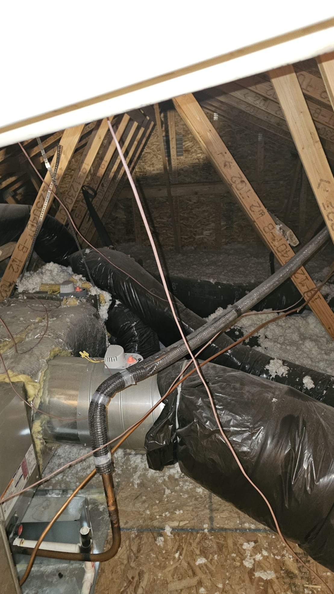 Image depicting a propane furnace installation in a home. A qualified furnace installer is carefully connecting the propane line. This highlights the importance of professional 'furnace installers near me' for safe and efficient propane furnace setups.