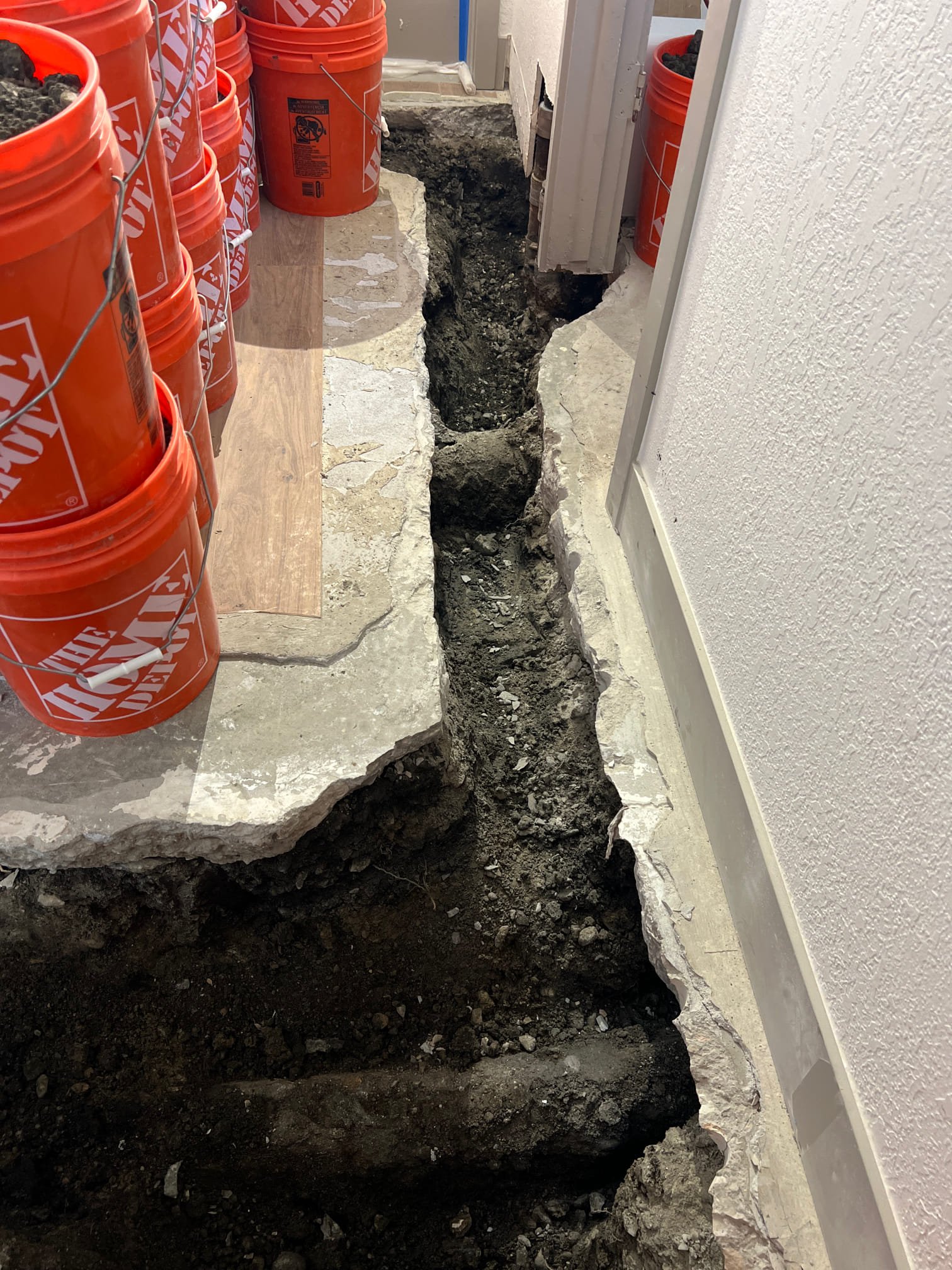 Image depicting residential flood cleanup after hours, highlighting the importance of 24-hour emergency services to prevent further damage. Consider investing in best whole home water filtration systems to ensure clean water after a flood.