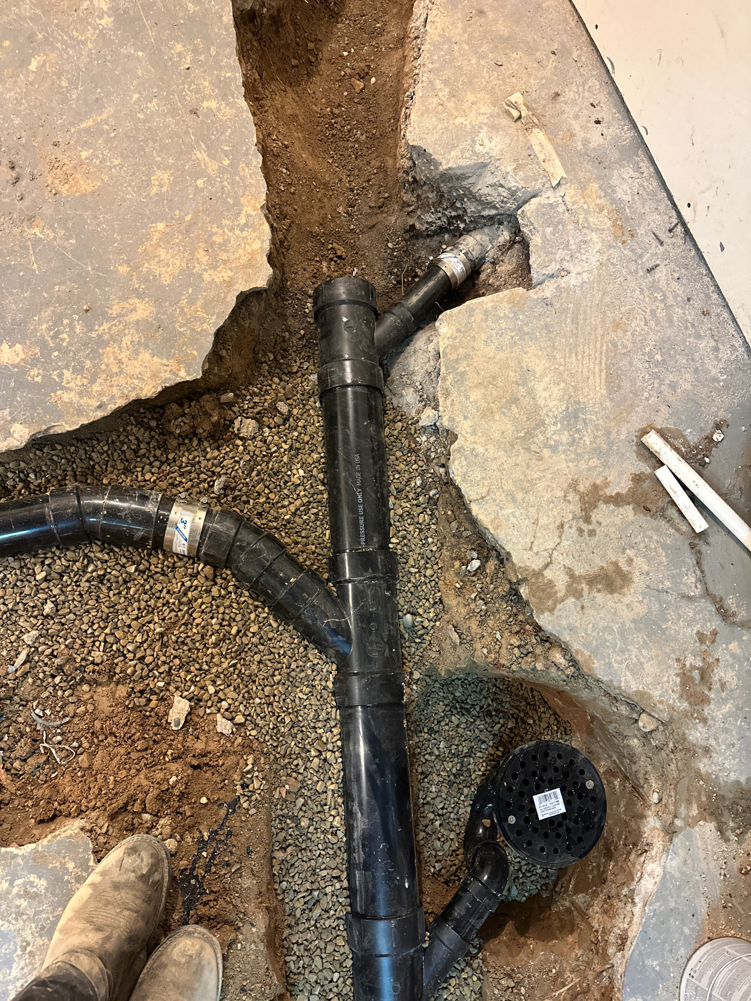 Commercial bathroom remodel featuring mold odor removal, highlighted by a fabric softener dispenser, suggesting freshness and cleanliness. Ideal for businesses seeking a hygienic and pleasant restroom environment.