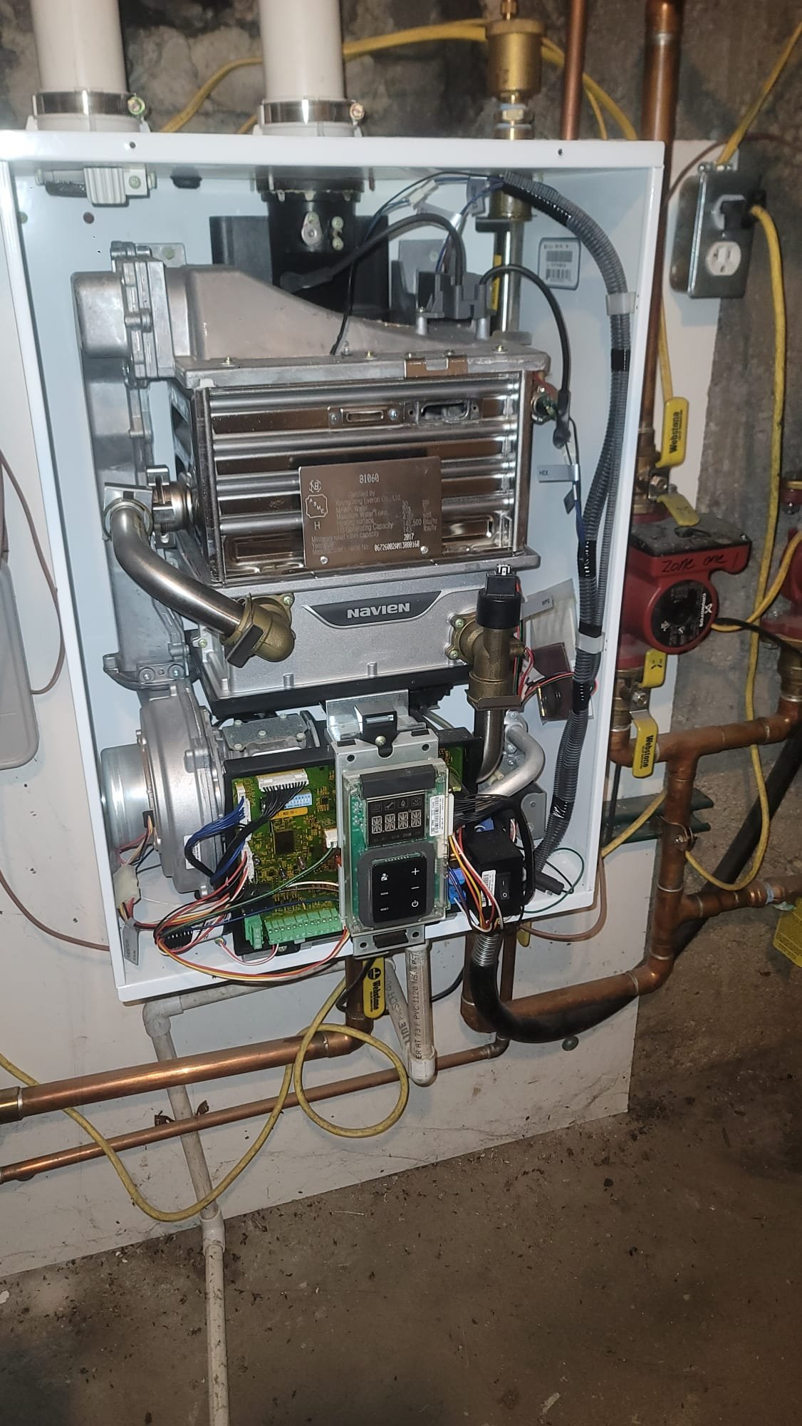 Professional HVAC installation featuring a modern boiler heater for efficient home heating and reliable hot water installation. Ensuring optimal performance and energy savings.