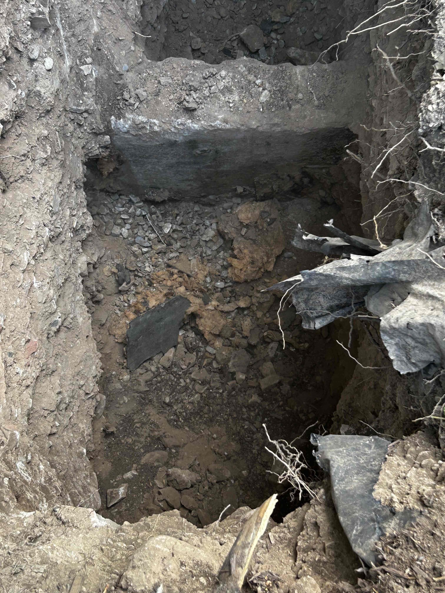 Image depicting same-day basement sewage backup remediation. Emphasizes the urgency of emergency basement sewage backup remediation following a septic clean-out issue. Shows professionals in protective gear addressing the sewage, highlighting quick response and thorough cleanup.