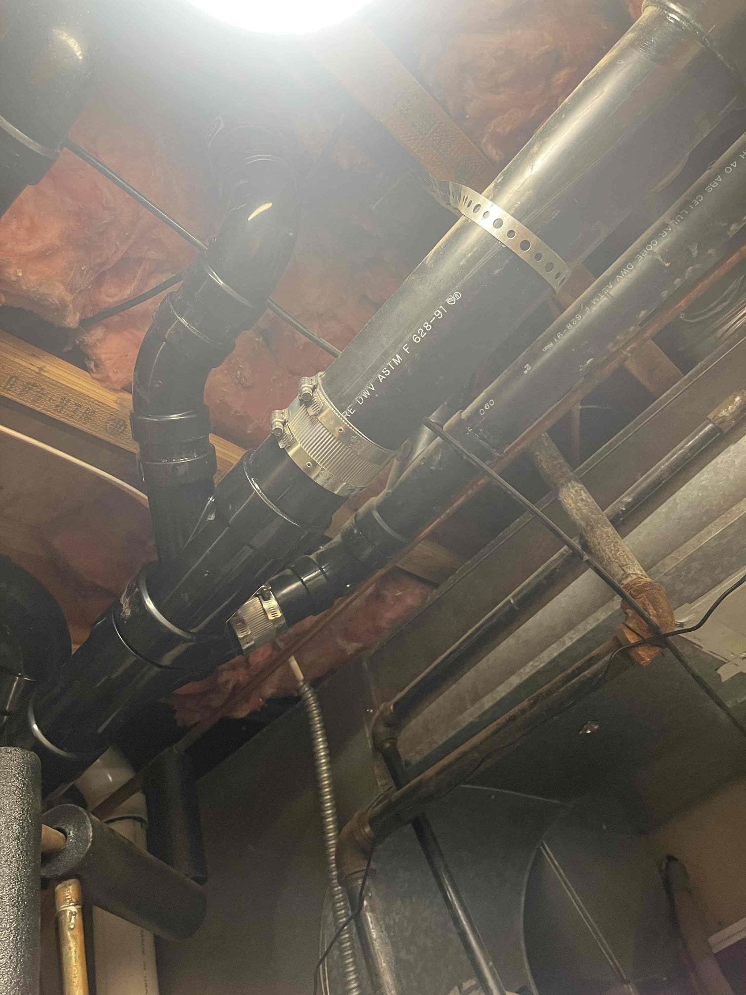 Clogged drain? Image depicting professional drain cleaning service ensuring smooth flow and preventing damage. We are a drain cleaning company specializing in removing obstructions, even those caused by a stuck drain stopper. Contact us for expert solutions!