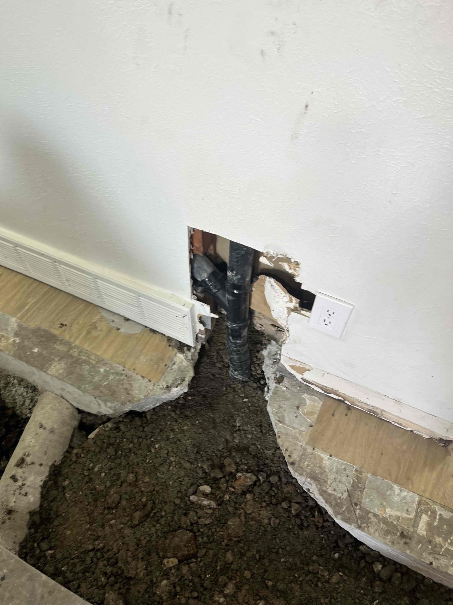 Image depicting mold abatement services, highlighting a professional wearing a protective mask during basement mold remediation. Focus on licensed mold damage repair, emphasizing safety and expertise in local mold removal.