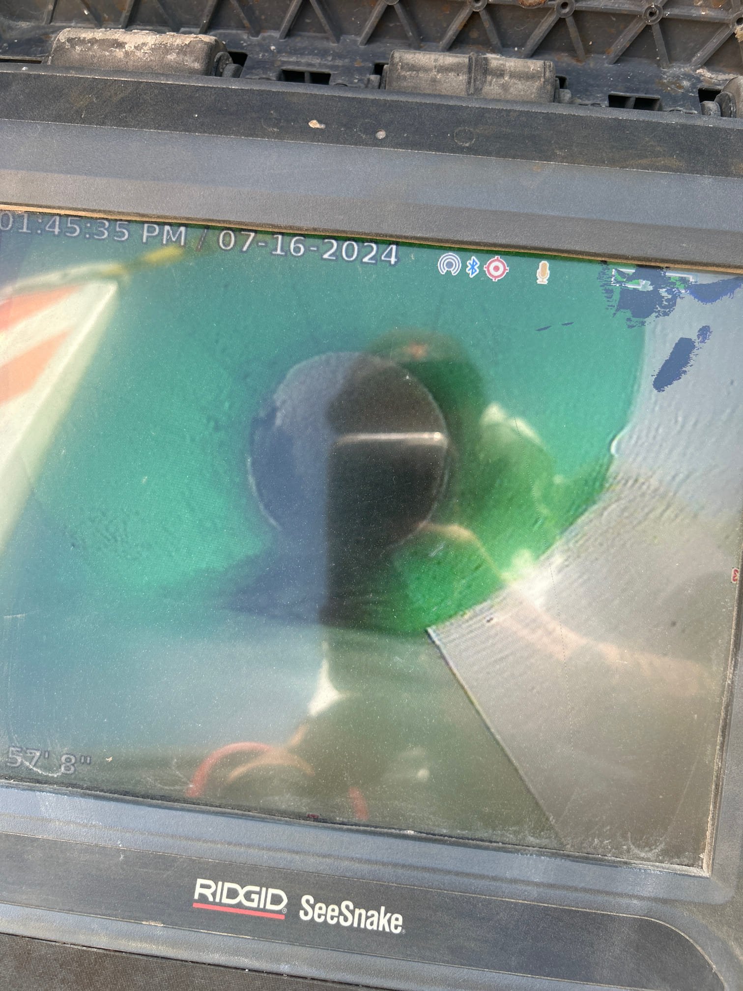 Image depicting licensed basement ceiling water damage, likely related to mold growth around a ceiling vent. Inspection for a basement ceiling water damage estimate is recommended to address potential structural issues and health hazards.