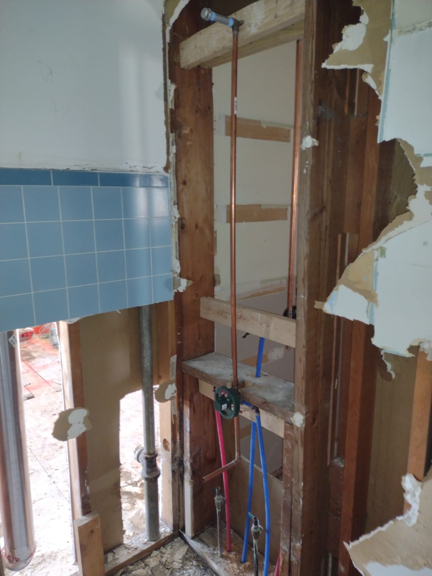 Image depicting a plumbing cleanout, essential for drain replacement and clearing clogged shower drains. A cleanout provides easy access to plumbing lines for maintenance and repair, preventing costly water damage.