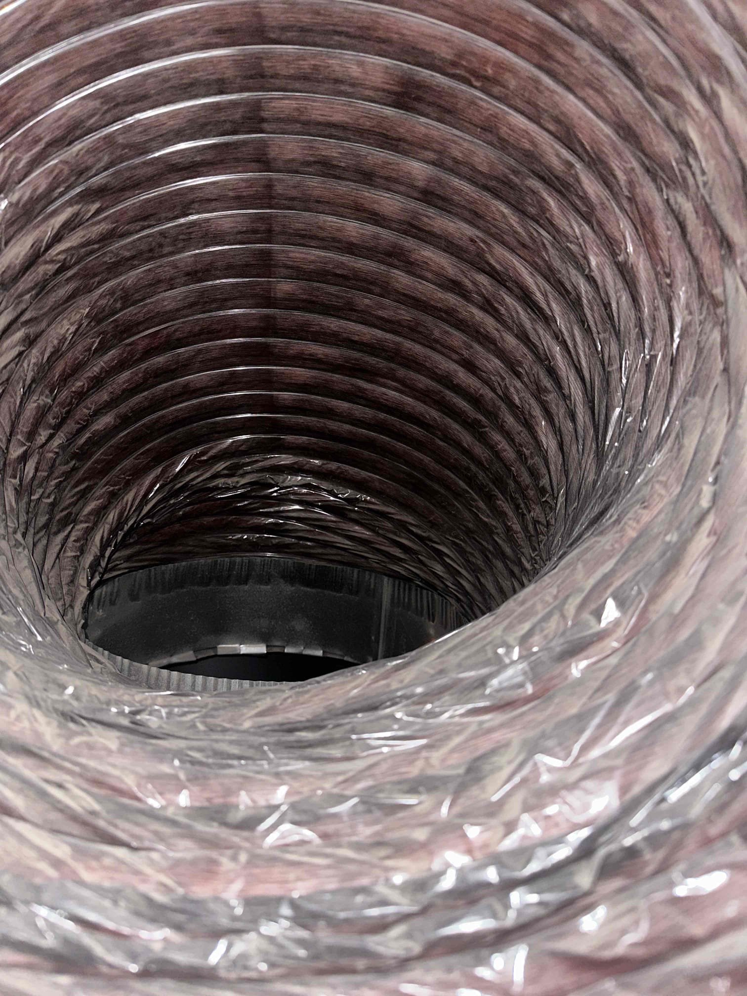 Image depicts the process of cleaning mold from HVAC ductwork, essential for improving indoor air quality. Proper cleaning, often involving accessing ducts through clean out access panels, helps prevent mold spores from circulating. Using the best air cleaner for mold after cleaning can further ensure a healthy environment.