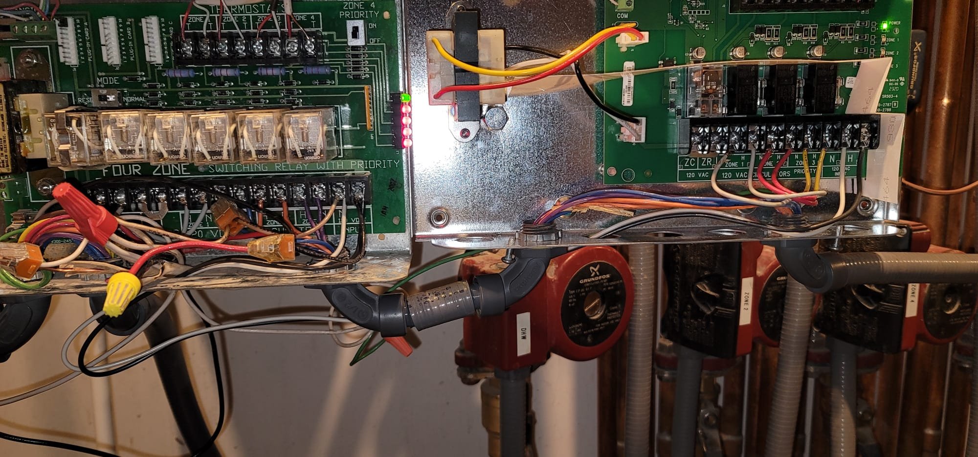 An old, complex house boiler system, highlighting potential repair needs and the eventual boiler replacement cost considerations for aging heating systems.