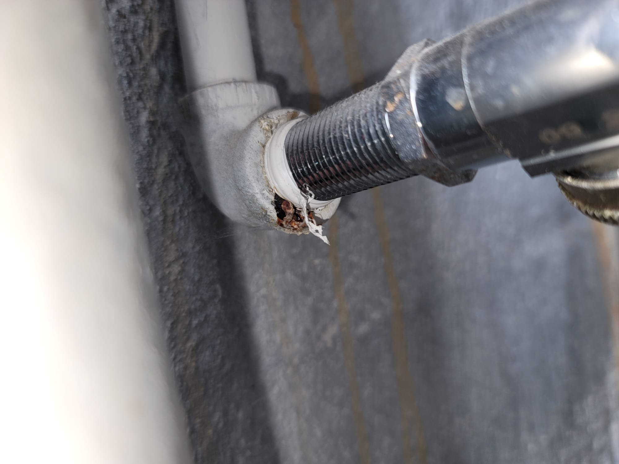 Image depicting a clogged garbage disposal, highlighting the importance of proper kitchen maintenance to prevent plumbing issues. A flooded kitchen could lead to significant damage, underscoring the need to understand and secure appropriate rental flood insurance. Define flood insurance: it's a policy that protects against water damage from external sources, crucial for renters in flood-prone areas. Protect your rental property, learn about flood insurance options.