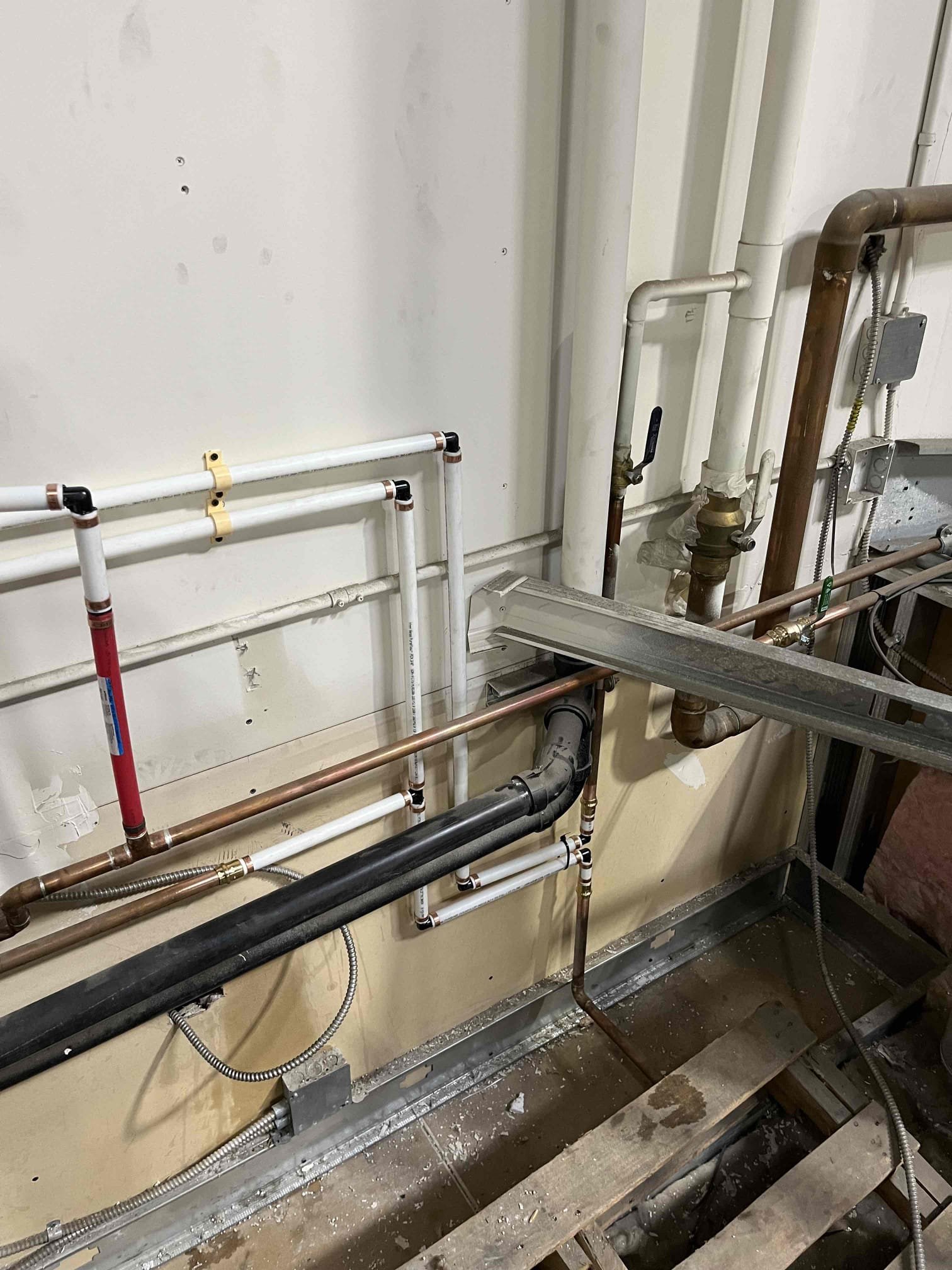 After-hours commercial drywall water damage remediation underway. Addressing urgent water damage to commercial drywall with same-day service to minimize business disruption and prevent further structural issues.