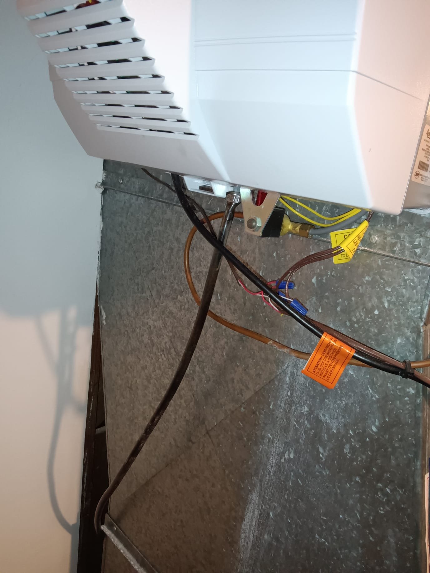 Residential drywall with water damage, potentially causing unpleasant odors. Image represents the need for professional residential drywall water damage odor removal to address issues like 'why does my hot water stink' and the associated removal costs.