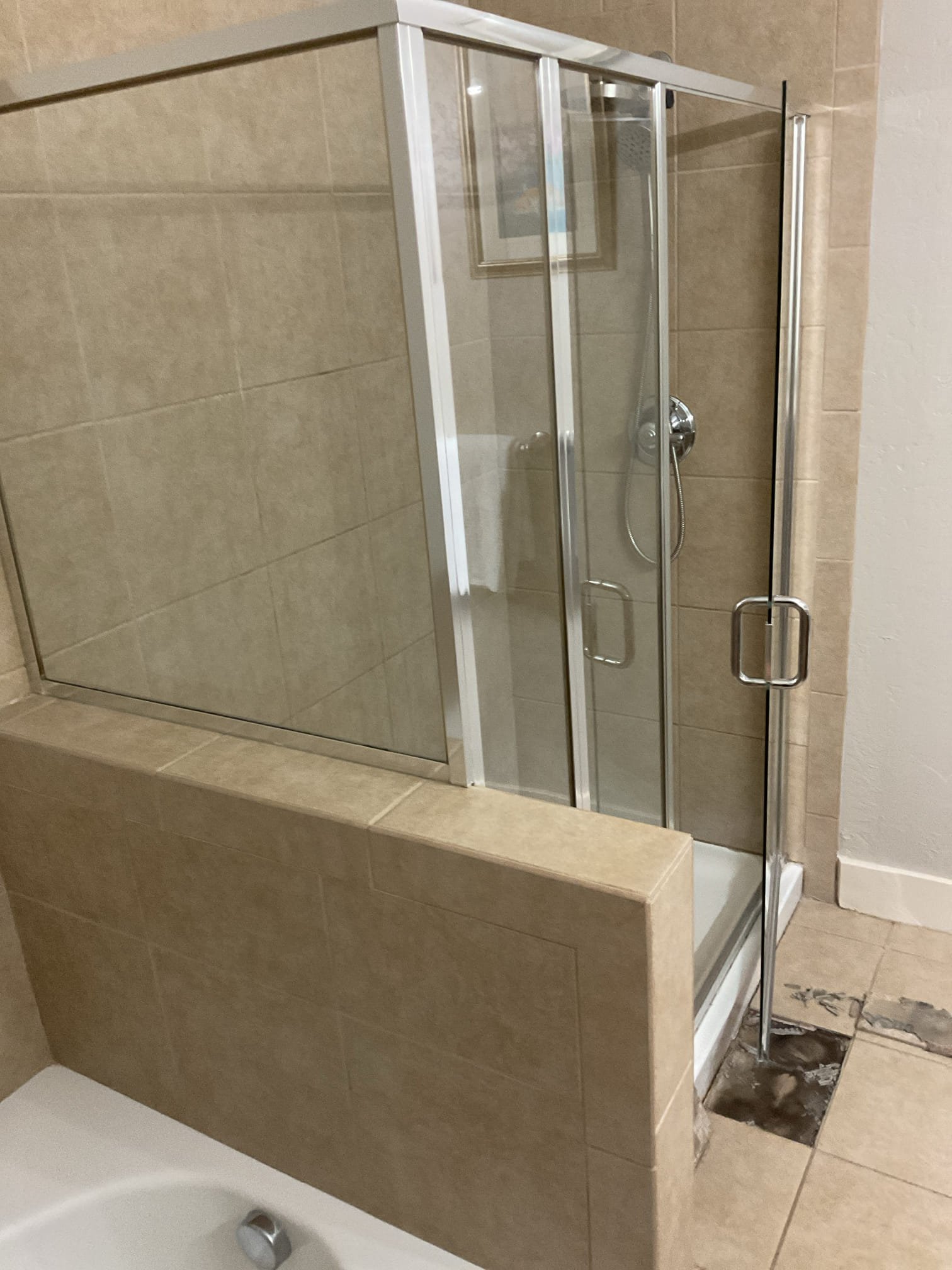 Garage air conditioner, potential source of water damage if not properly maintained, especially near natural gas water heaters. Inspect regularly to prevent costly repairs.