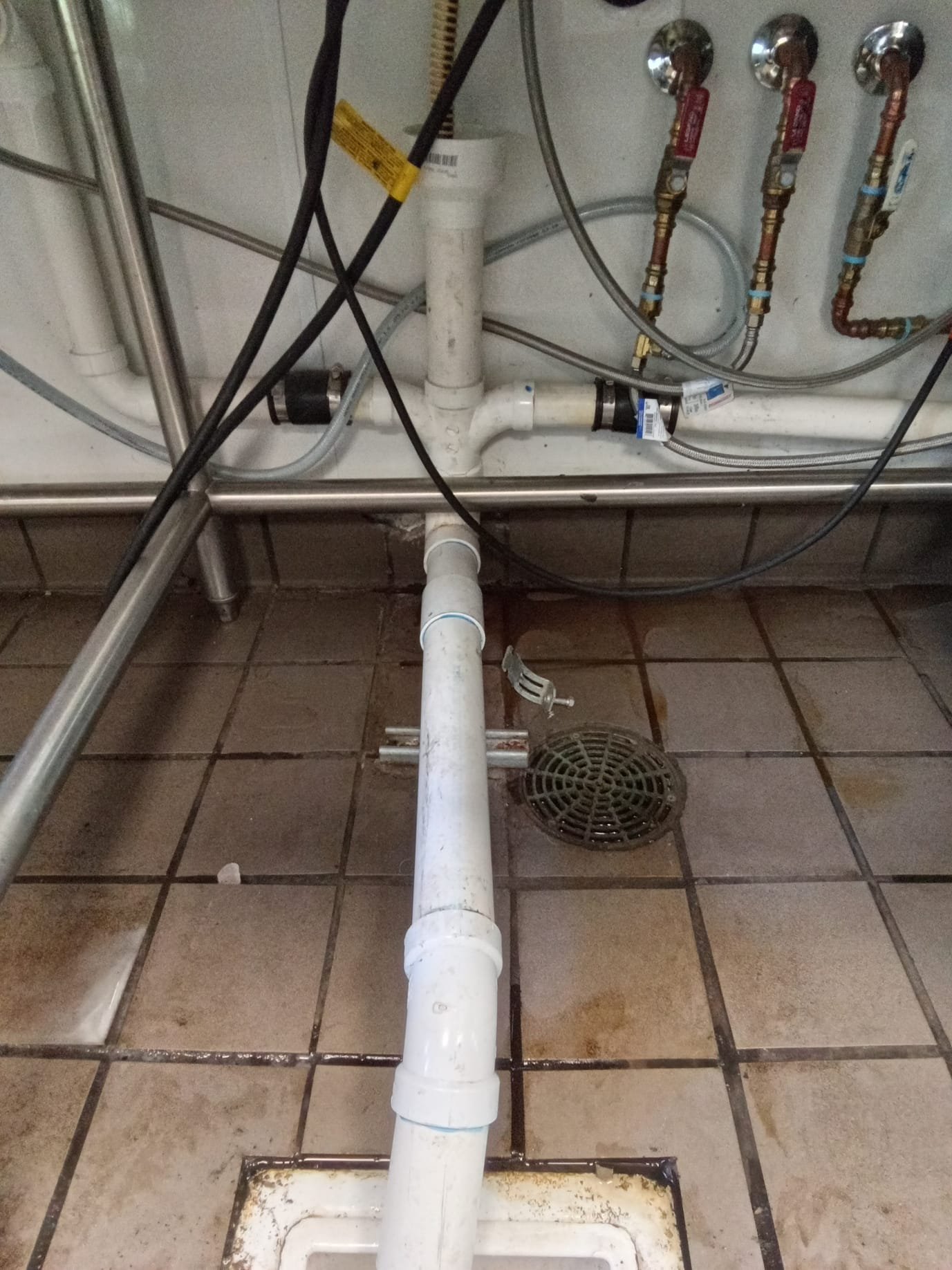 Commercial ceiling with water stains indicating potential water damage and a lingering sulfur odor. Inspection for odor removal services related to water damage, addressing issues like sulfur smells often associated with water intrusion. Focus on identifying and eliminating the source of the odor in commercial ceilings.