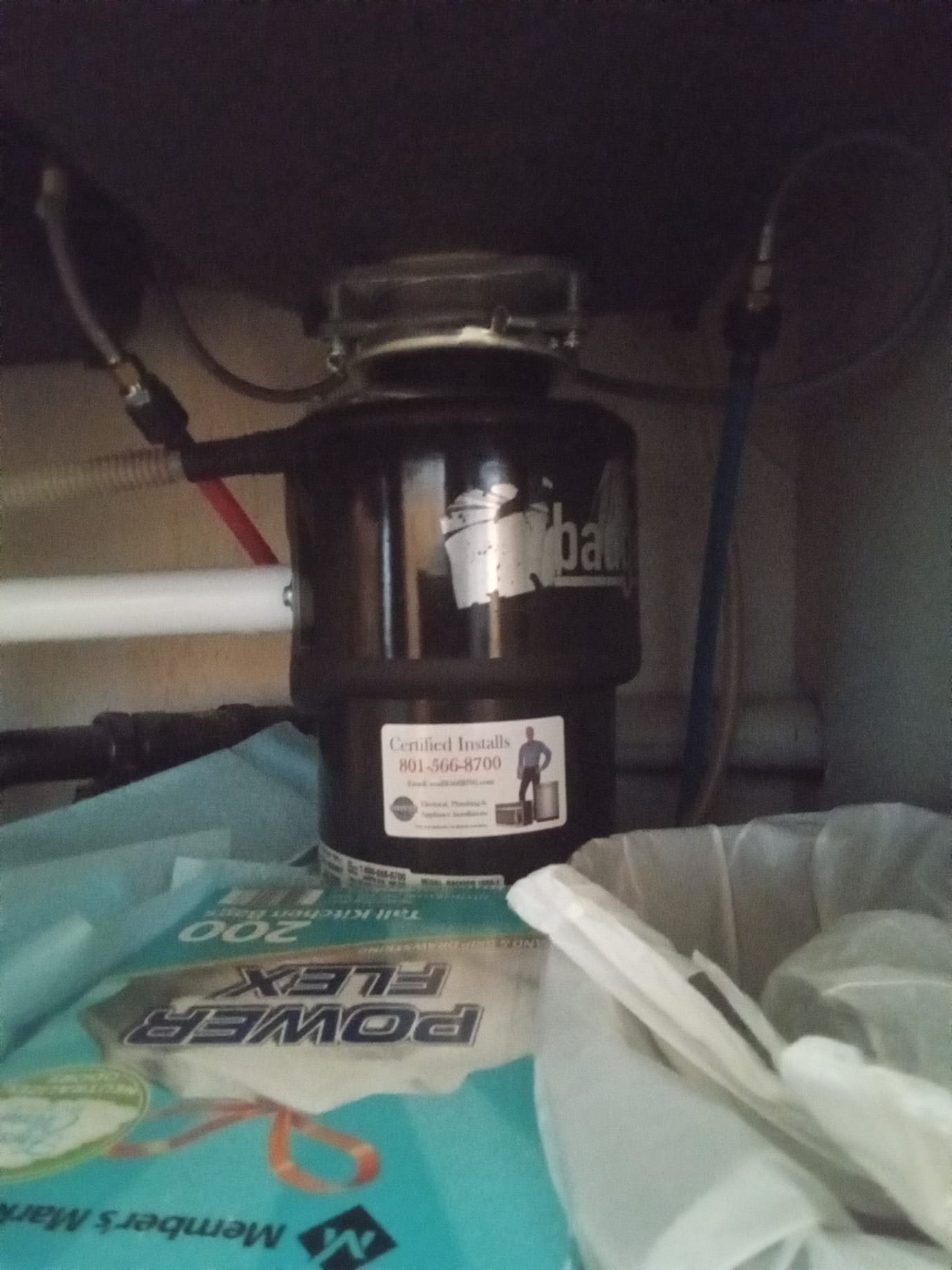 Image related to backflow testing costs, potentially showing sewage line cleaning equipment in use to prevent sinks from backing up. Illustrates the importance of backflow prevention to avoid costly plumbing issues.