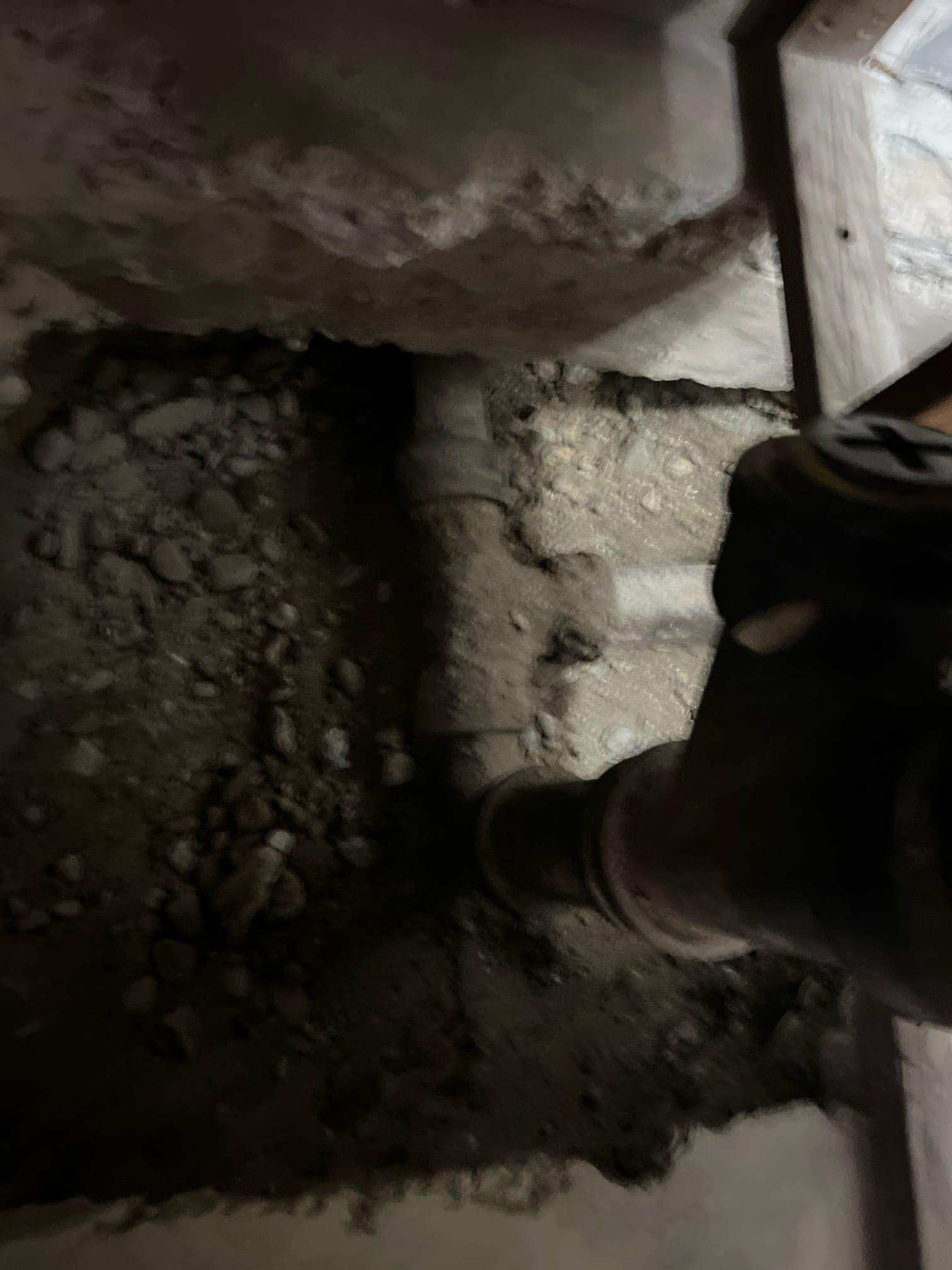 Kitchen sink backup indicating a potential sewage pump repair issue. Sewage nearby suggests a plumbing problem requiring immediate attention to prevent further contamination and property damage.