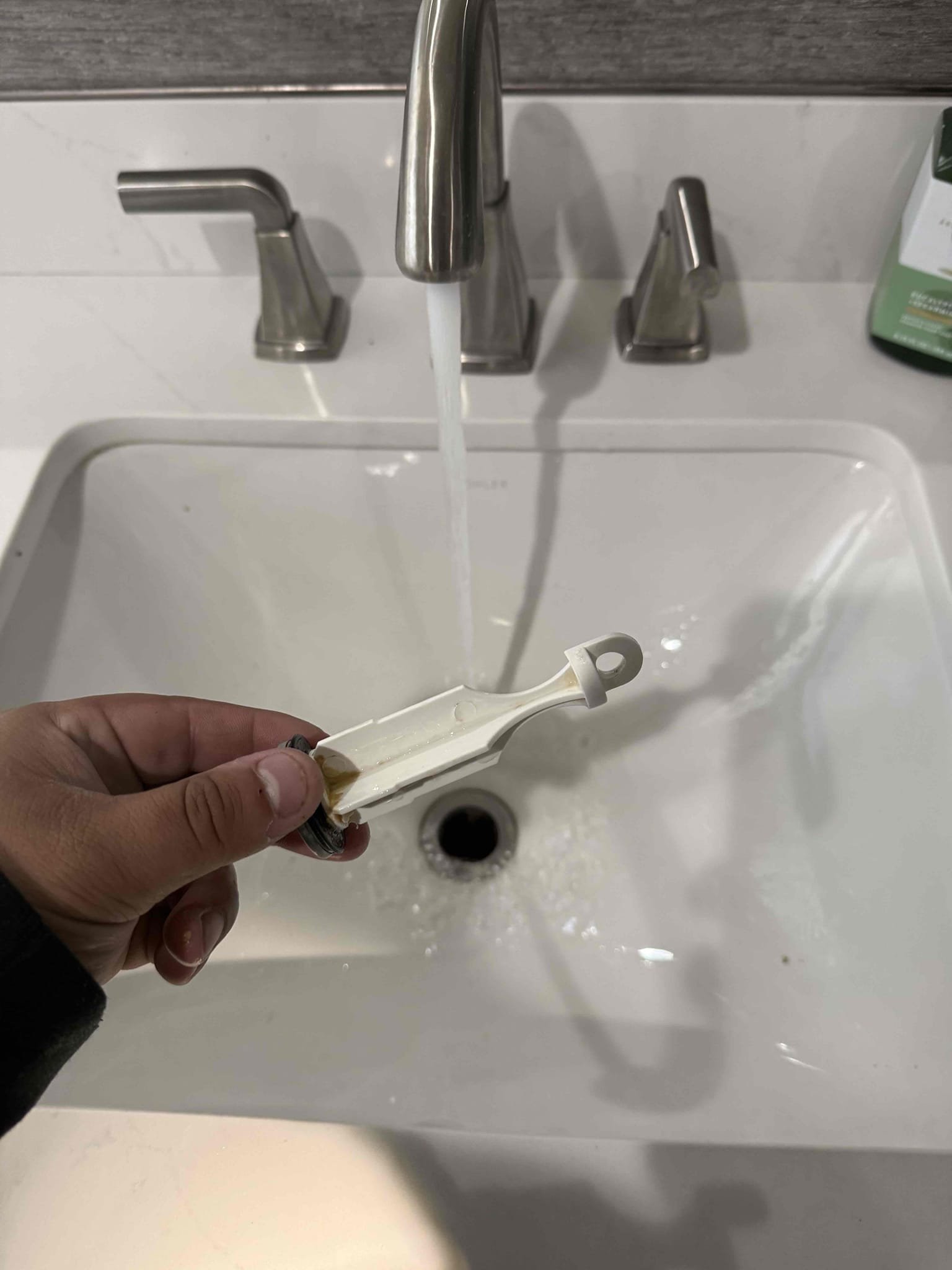 West Jordan, Utah: Commercial bathroom sink being cleaned with baking soda and vinegar to diagnose mold issues. Addressing mold before professional repair in local businesses.