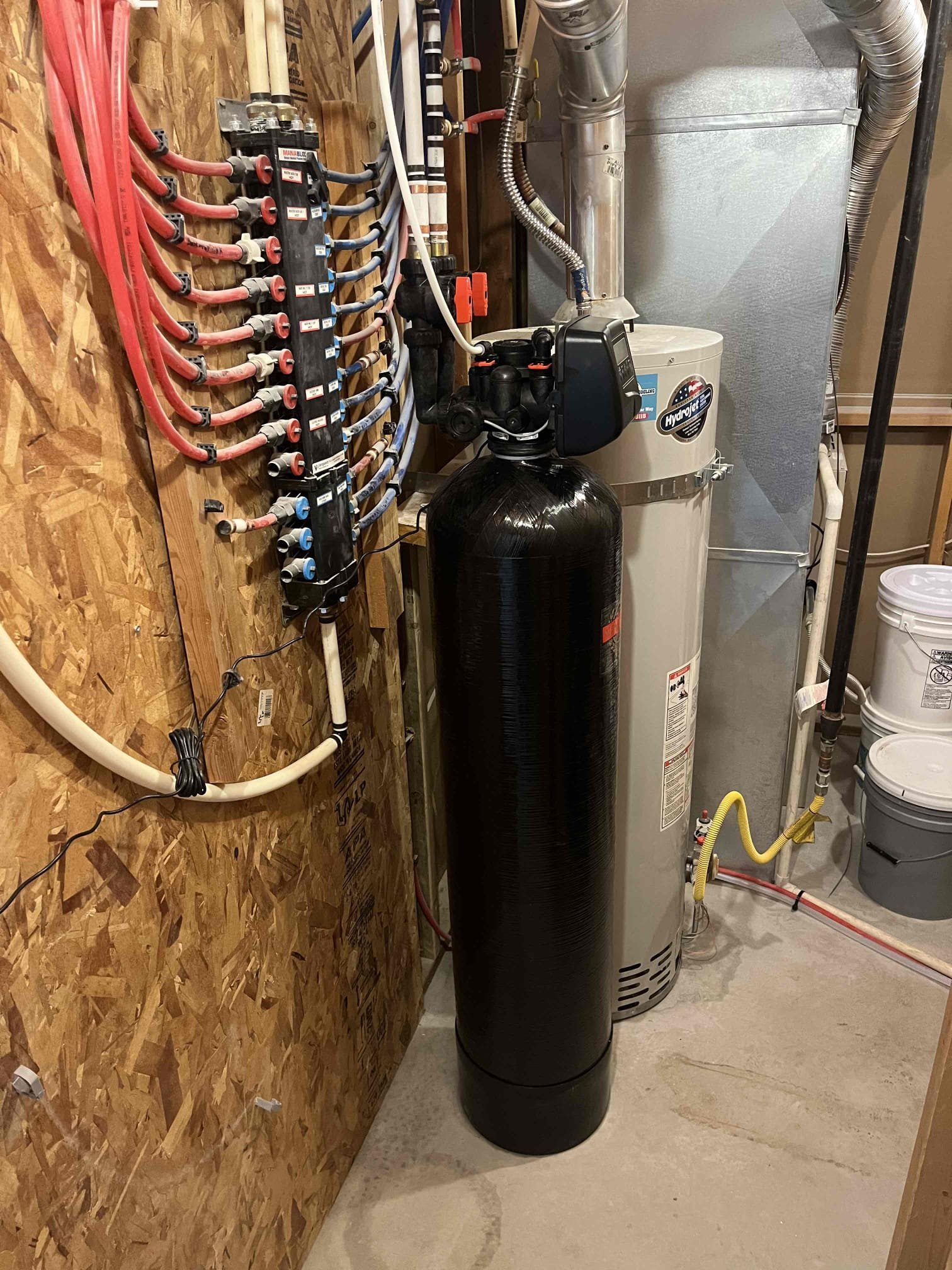 Compare bottled water and filtered water against a backdrop of soot-stained walls and drywall water damage, highlighting potential long-term cost savings and reduced environmental impact compared to the expense of water damage restoration. Consider the implications for home maintenance and repair costs associated with water damage.