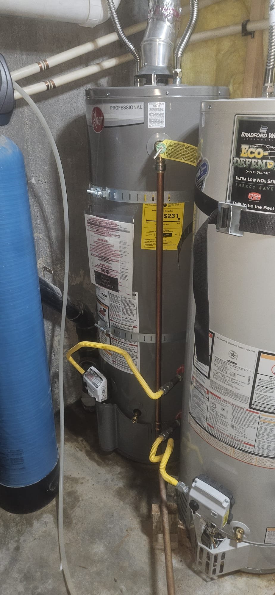 Frustrated person bundled in blankets inside a cold house, possibly due to a broken heating system. Consider exploring options like 'heat pump installation near me' or assessing the 'cost to install water heater' as potential solutions for home heating issues.