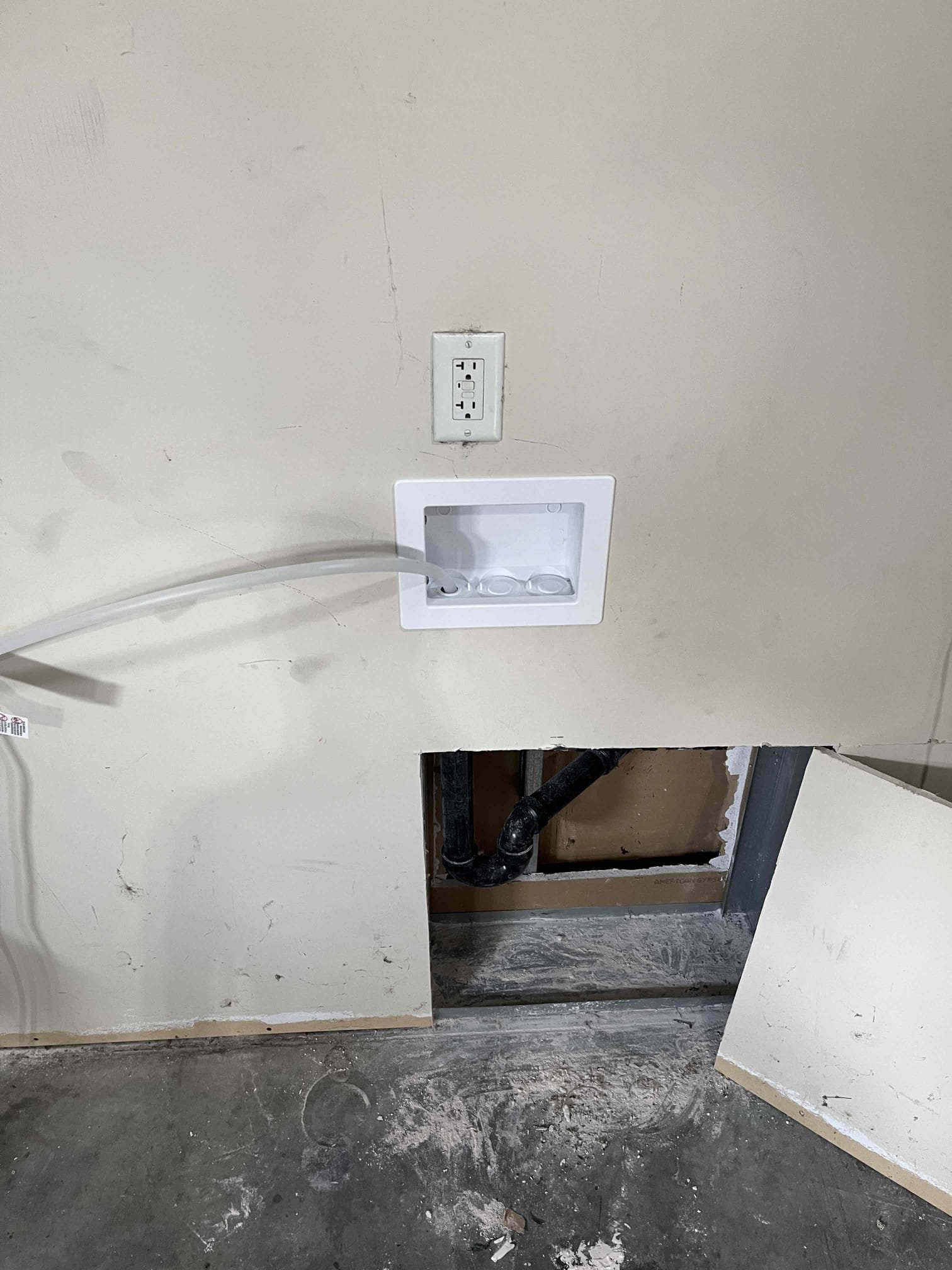 Image depicts affordable commercial drywall water damage recovery options, contrasting DIY soft water system solutions with professional, insured services. Highlights cost-effective approaches to water damage repair in commercial settings.