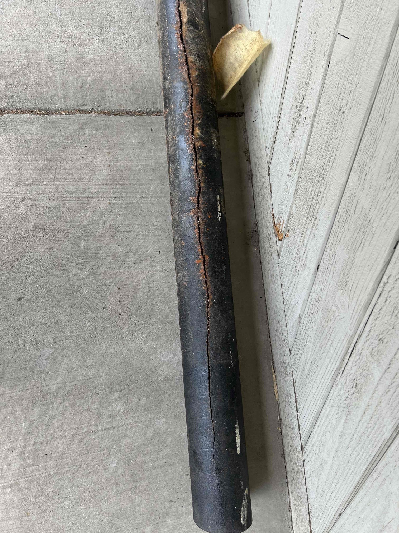 A drain auger, also known as a plumbing snake, is shown, representing a common tool used for drain tune-ups and repair. It effectively removes obstructions from sluggish drains, restoring proper flow.