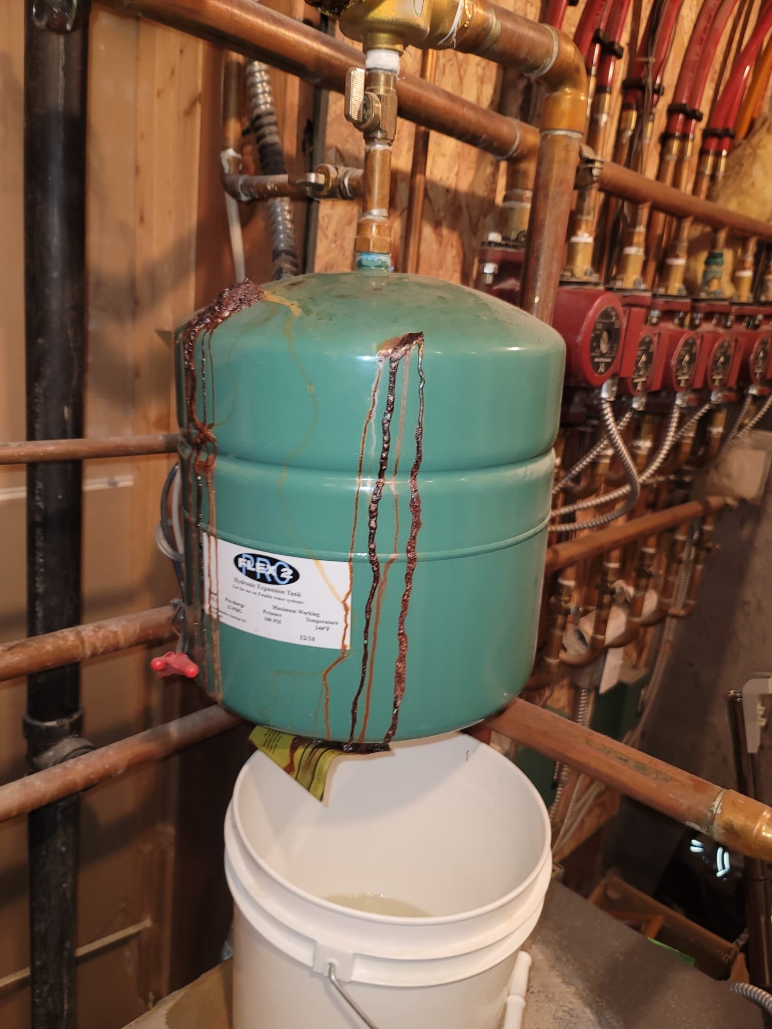 A plumber skillfully repairs a clogged toilet, highlighting the importance of professional toilet repair and inspection services.