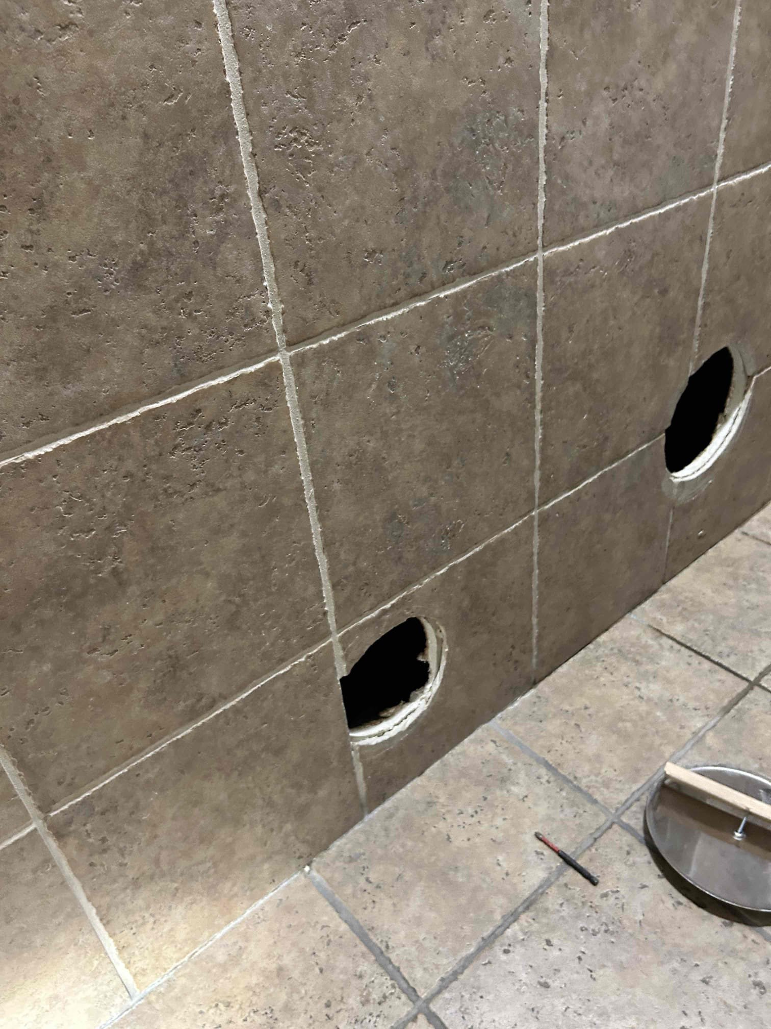 Residential bathroom with potential mold issue causing unusual odors, possibly resembling gasoline. Seeking professional mold odor removal diagnosis and remediation to eliminate the source and restore a healthy environment.