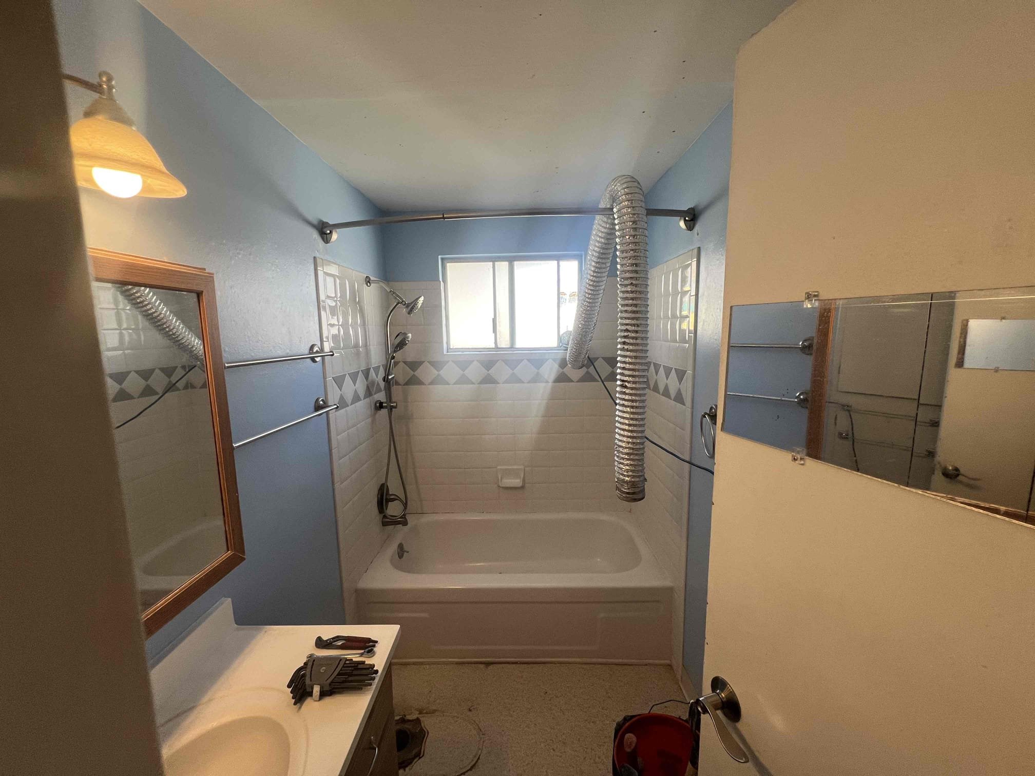 Close-up of hands changing a home water filter, highlighting preventative maintenance to avoid costly water line repairs. An easily replaceable filter ensures clean water and can prevent the need for residential water line repair due to sediment buildup and corrosion. Regular filter changes are a simple way to minimize your water line repair cost.