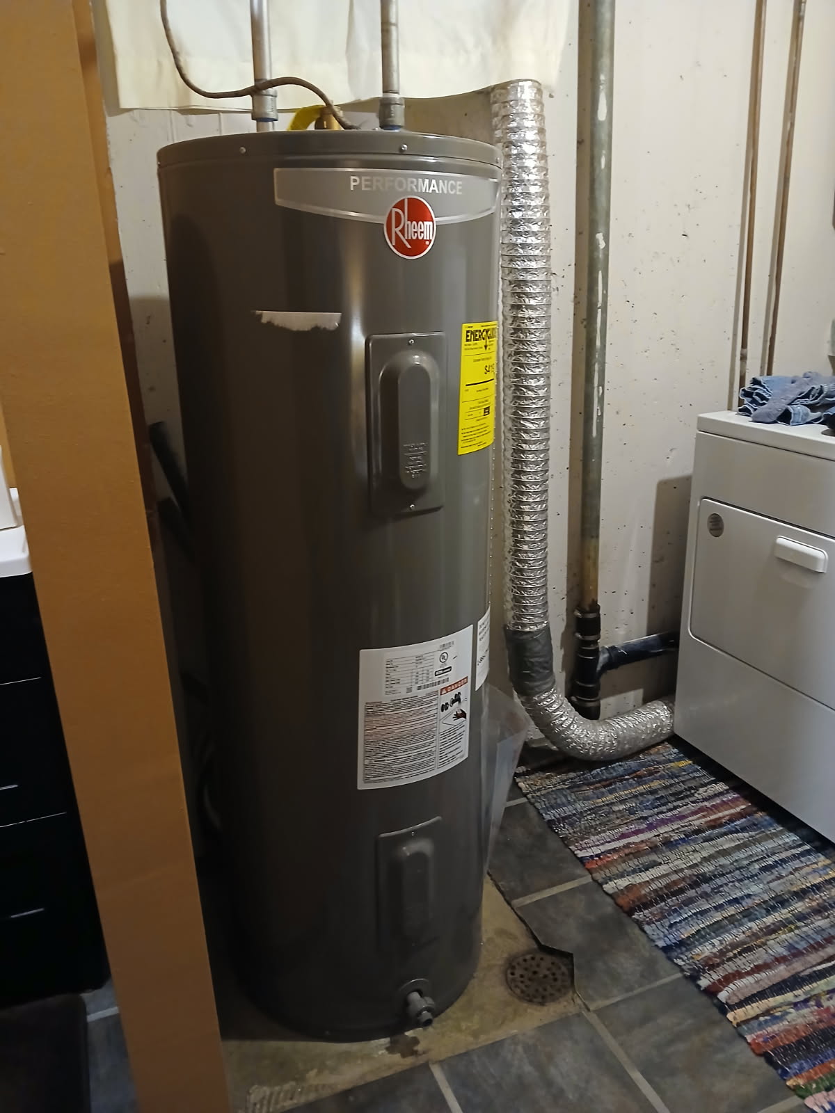 Image depicting a technician repairing a gas water heater. Ideal for water heater repair companies and promoting water heater repair services.