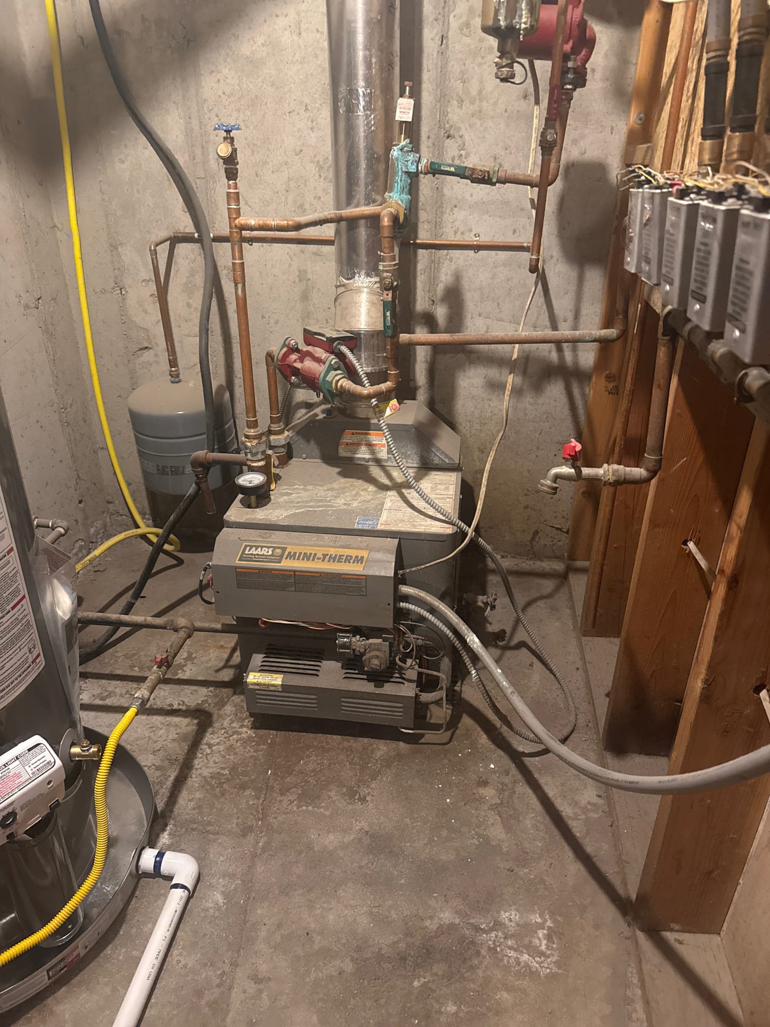 Image of heating boilers, a key service offered by heating and cooling companies. Efficient propane boilers for home heating solutions are also available, ensuring optimal temperature control and energy savings.