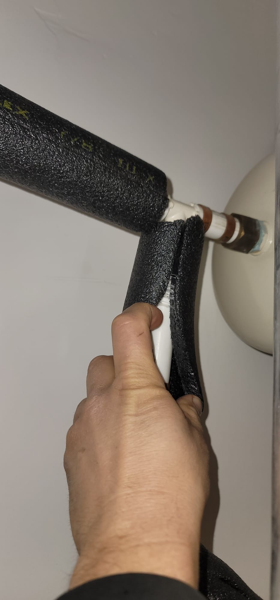 A certified backflow tester inspects a plumbing system, ensuring proper function and preventing water contamination. This inspection helps protect against water backups, which can be covered by specialized water backup insurance coverage, safeguarding homeowners from costly damage.