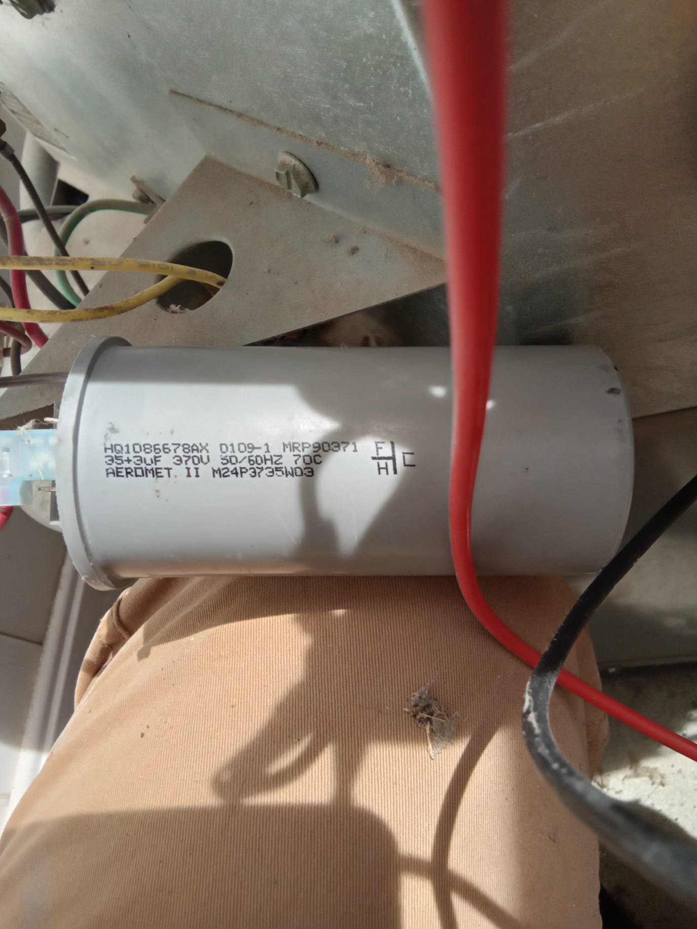 HVAC tune-up being performed on a Goodman air conditioning unit, ensuring efficient operation and optimal performance. Regular residential air conditioning tune-up service can improve energy efficiency and prevent costly repairs, as highlighted in positive Goodman air conditioning reviews.