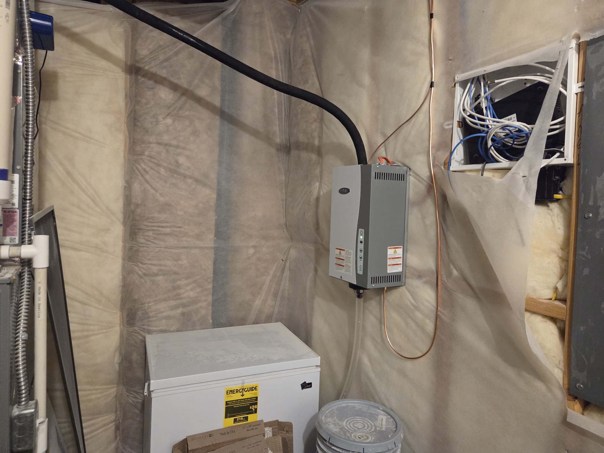 Damp basement interior with concrete walls, addressing both mold and gas odors. Focus on solutions for removing mold from concrete basement walls and eliminating musty or gas smells to improve air quality and safety.