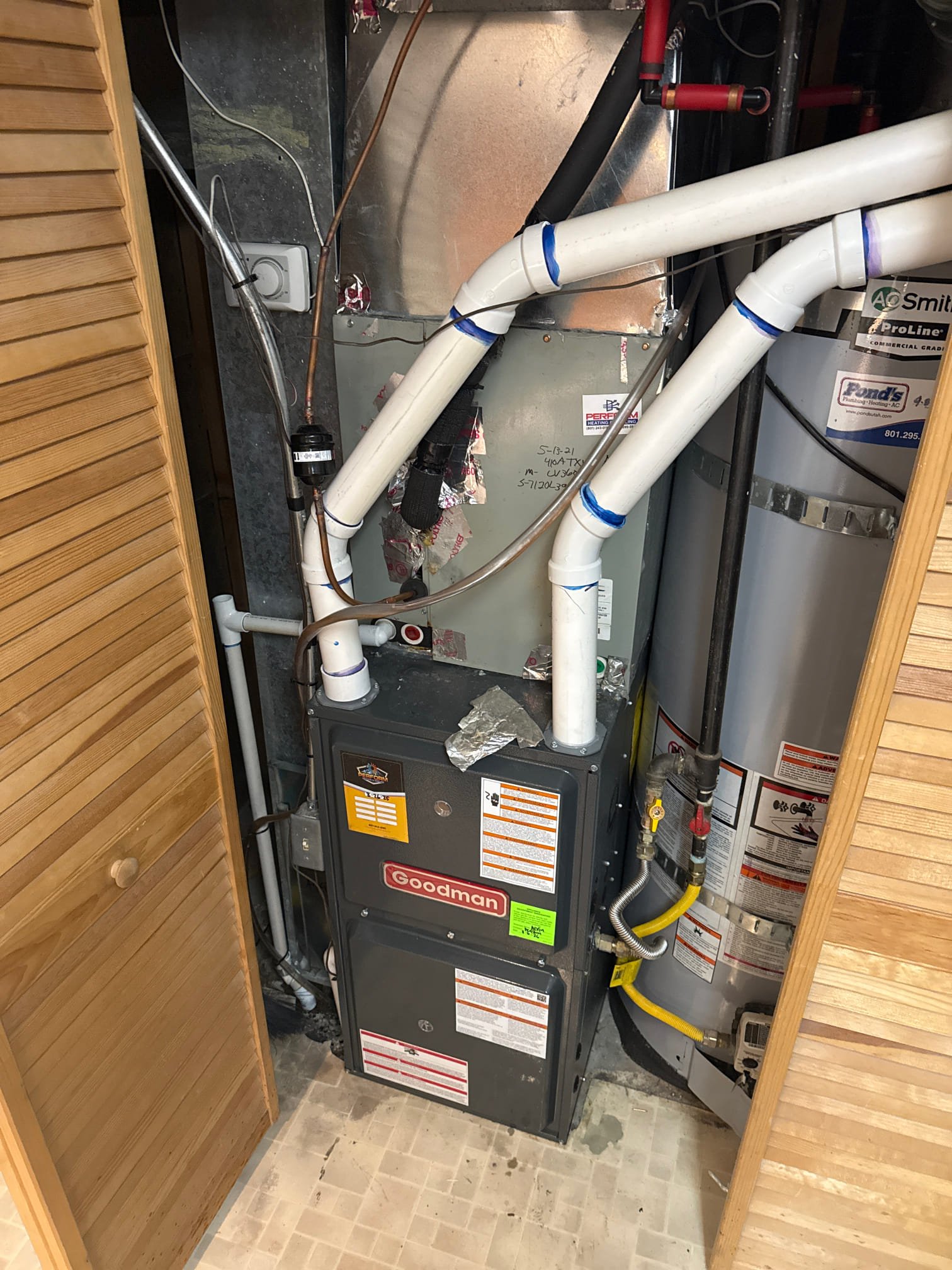 Close-up of an air conditioner unit emphasizing its importance for air conditioning and dehumidification. Regular HVAC monthly maintenance, including annual servicing, ensures efficient operation and prevents costly repairs.
