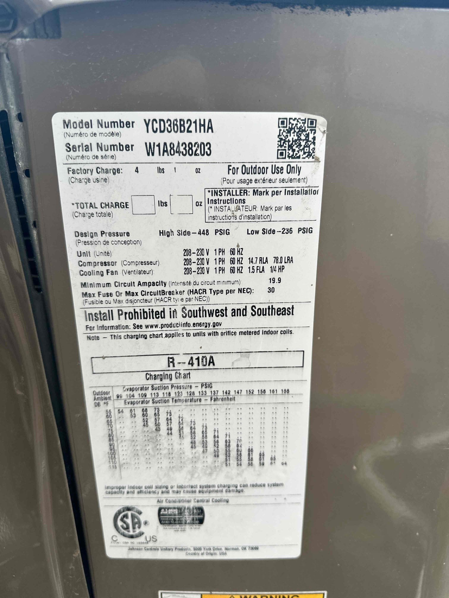 Residential backflow valve, a plumbing component often serviced by HVAC contractors, with a mini-split AC unit visible outside. Important for plumbing maintenance and system integration.