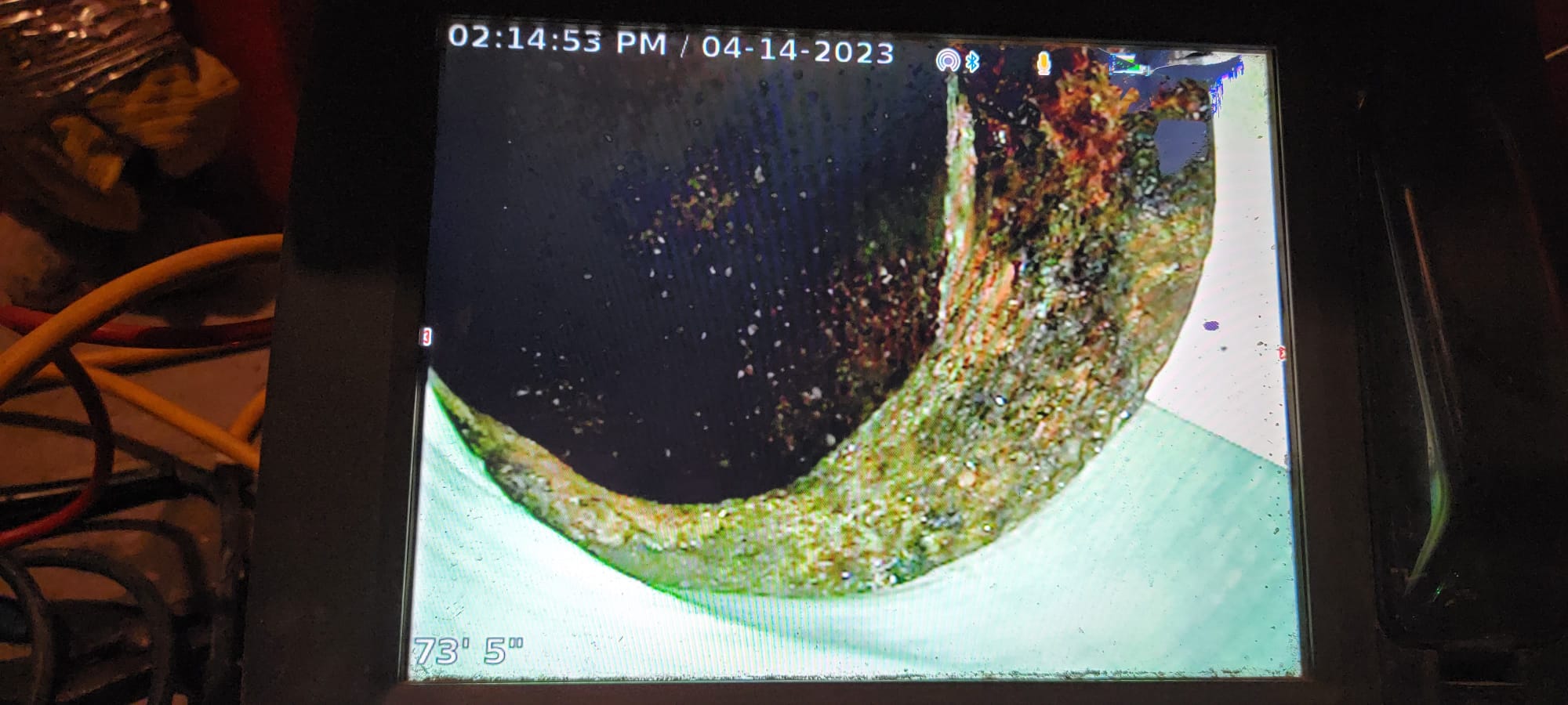 Close-up image of toilet inspection installation, highlighting pipe cleaner use. Focuses on toilet inspection repair, showcasing plumbing maintenance and hygiene.