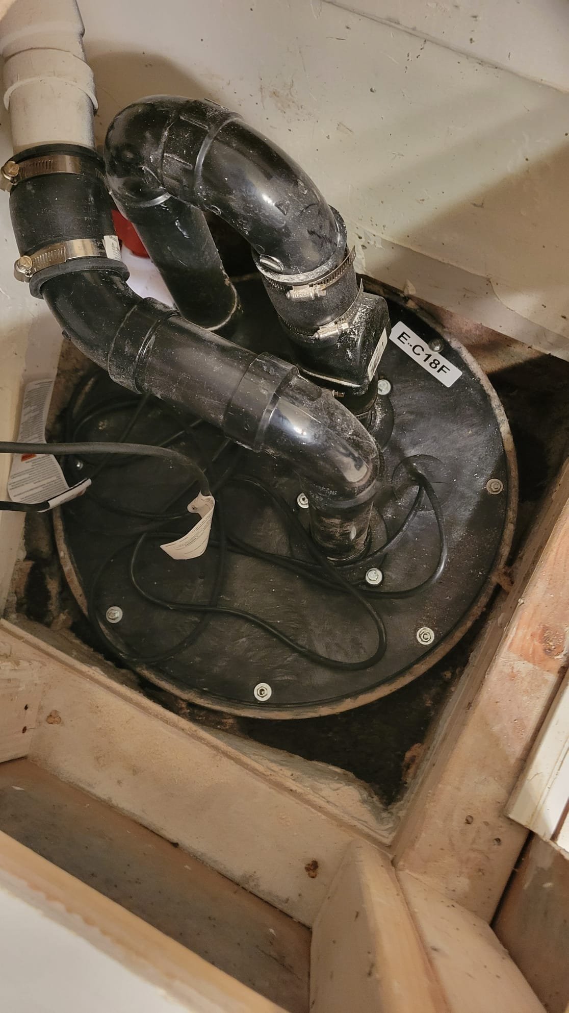 Image depicting a 24-hour plumber responding to a sewer backup in a home. Illustrates the urgency of residential sewer maintenance and raises the question of whether homeowners insurance covers such incidents. Highlights the importance of preventative care to avoid costly repairs and potential insurance claims related to sewer issues.