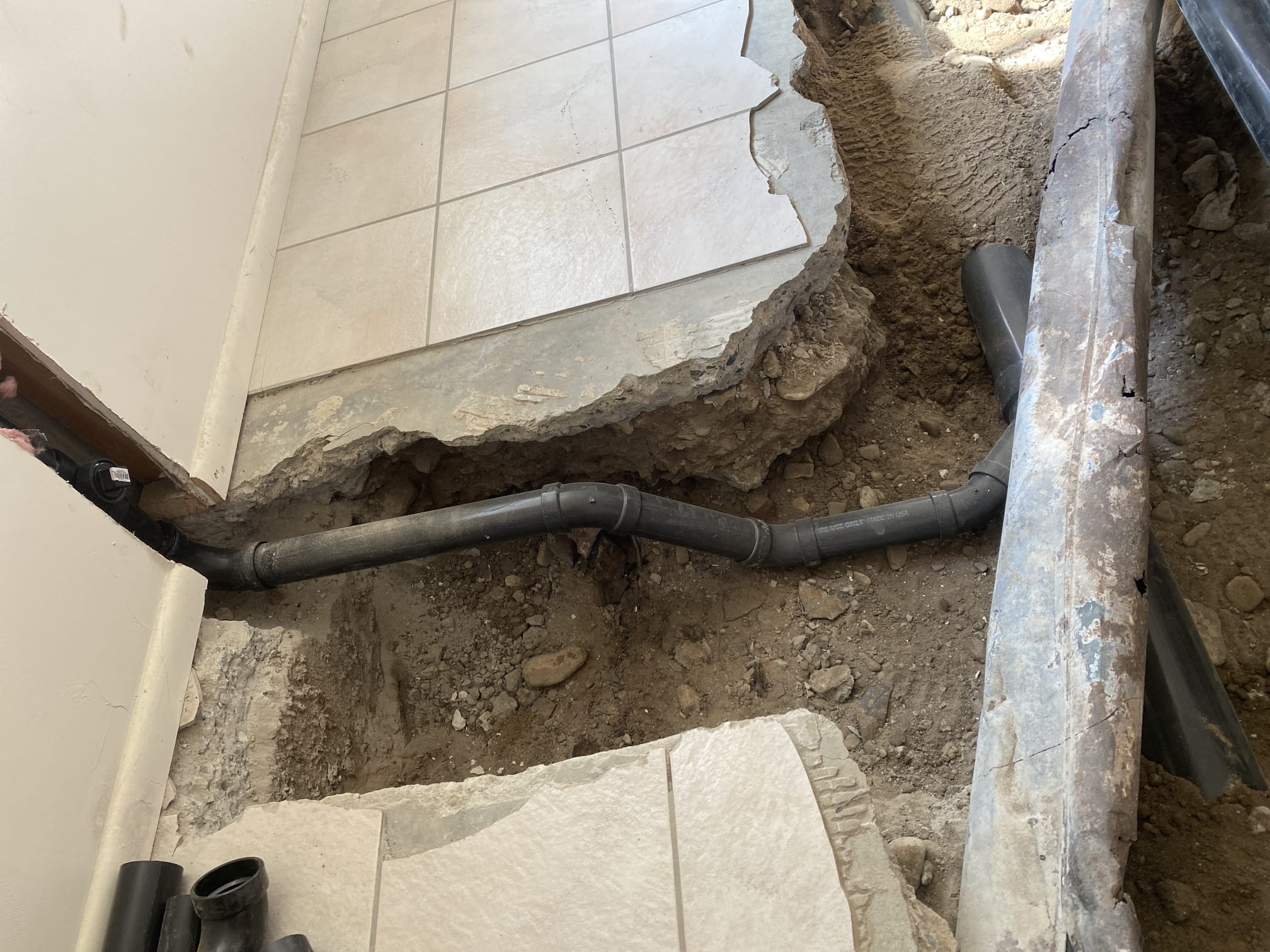 Image depicting a commercial building's plumbing system being inspected by a plumber. Conceptually relates to finding 'free plumbing estimates near me,' 'commercial plumber near me,' and a reputable 'plumbing co near me' for business plumbing needs.