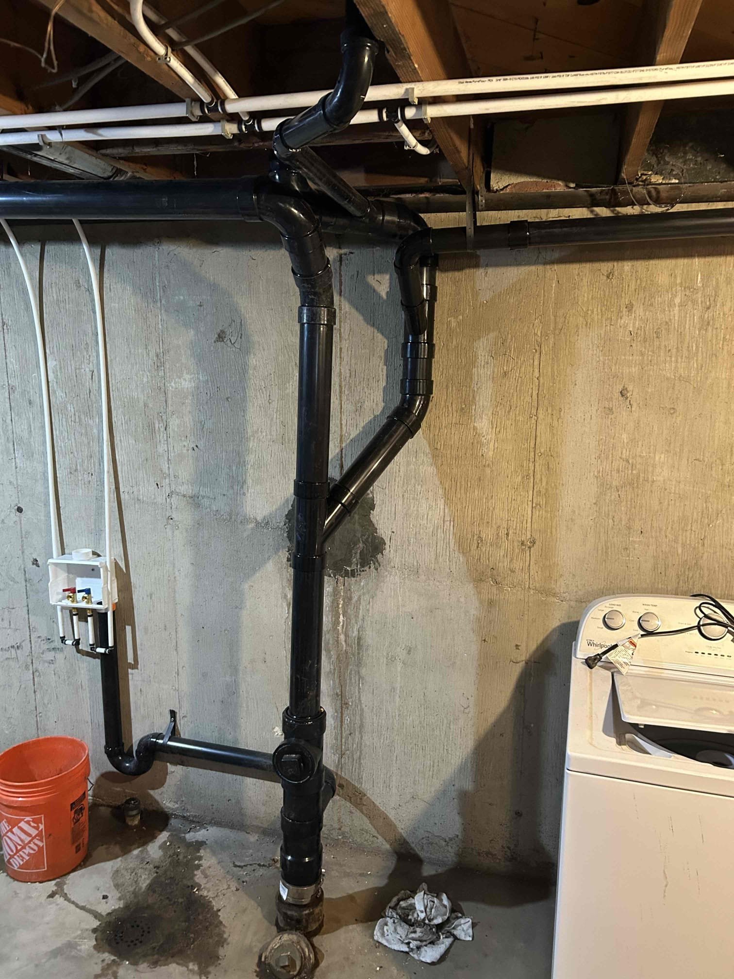 Ceiling water damage repair in a home, potentially linked to well water contamination issues. Addressing water damage and ensuring clean water with purification systems.