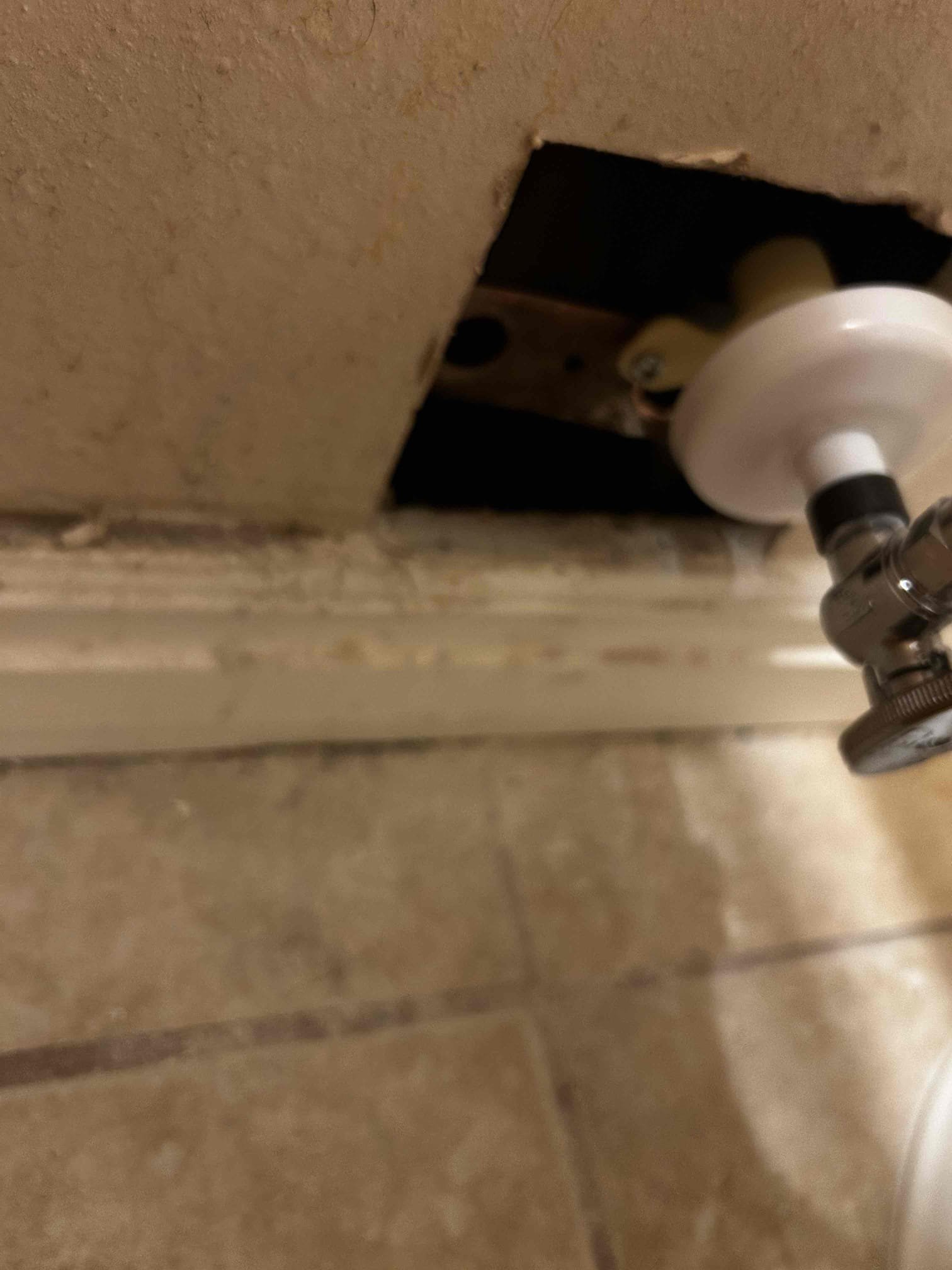 Residential ceiling showing water damage, a potential source of musty odors, possibly related to sulfur-like smells from the hot water system. Call a professional residential ceiling water damage odor removal service for inspection and installation of odor removal solutions.