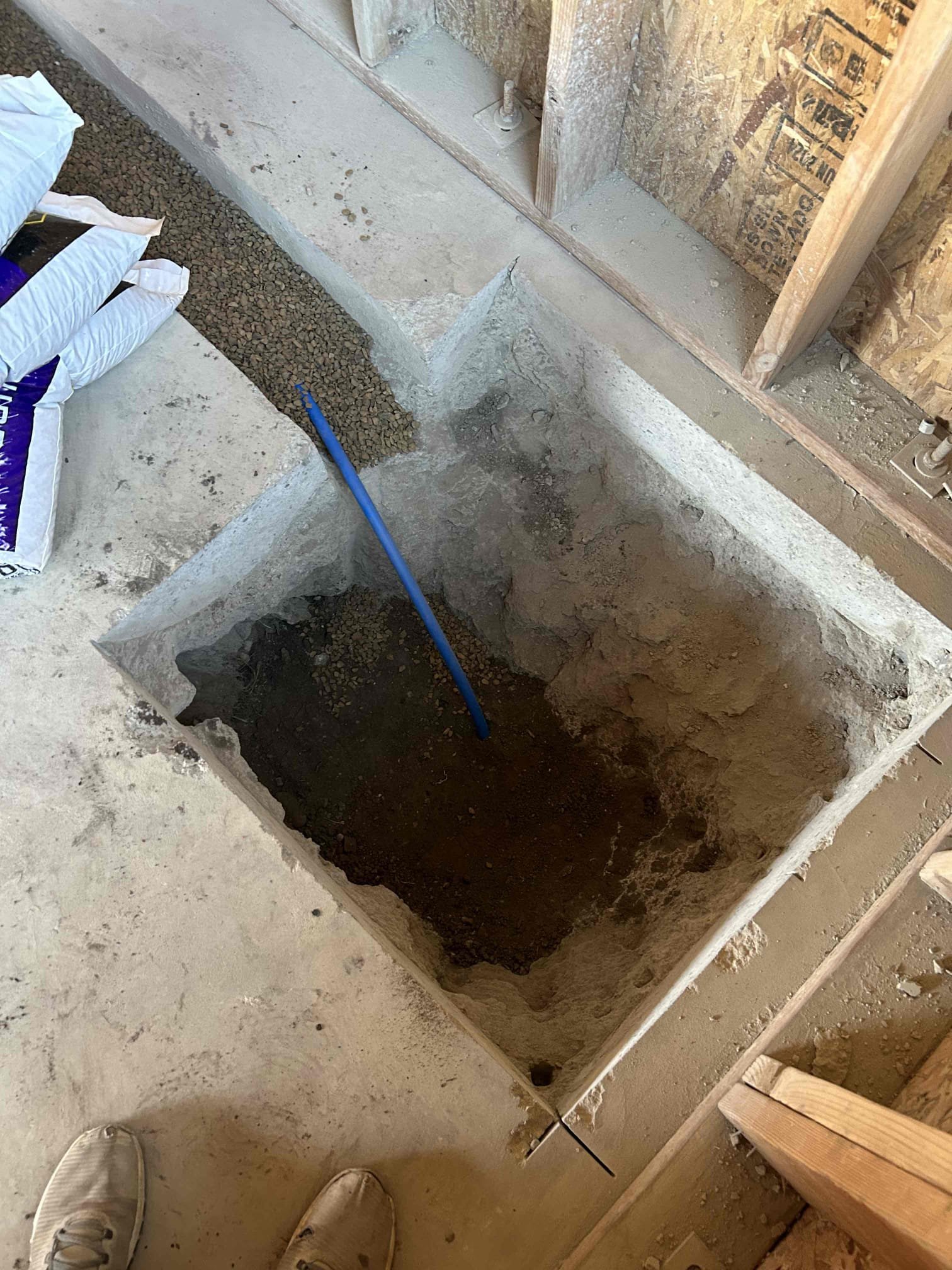 Image showing a construction site with workers replacing a corroded water main pipe. This infrastructure project is similar to sewer main replacement, impacting property value and highlighting potential costs associated with plumbing repairs, such as sewer stack replacement.