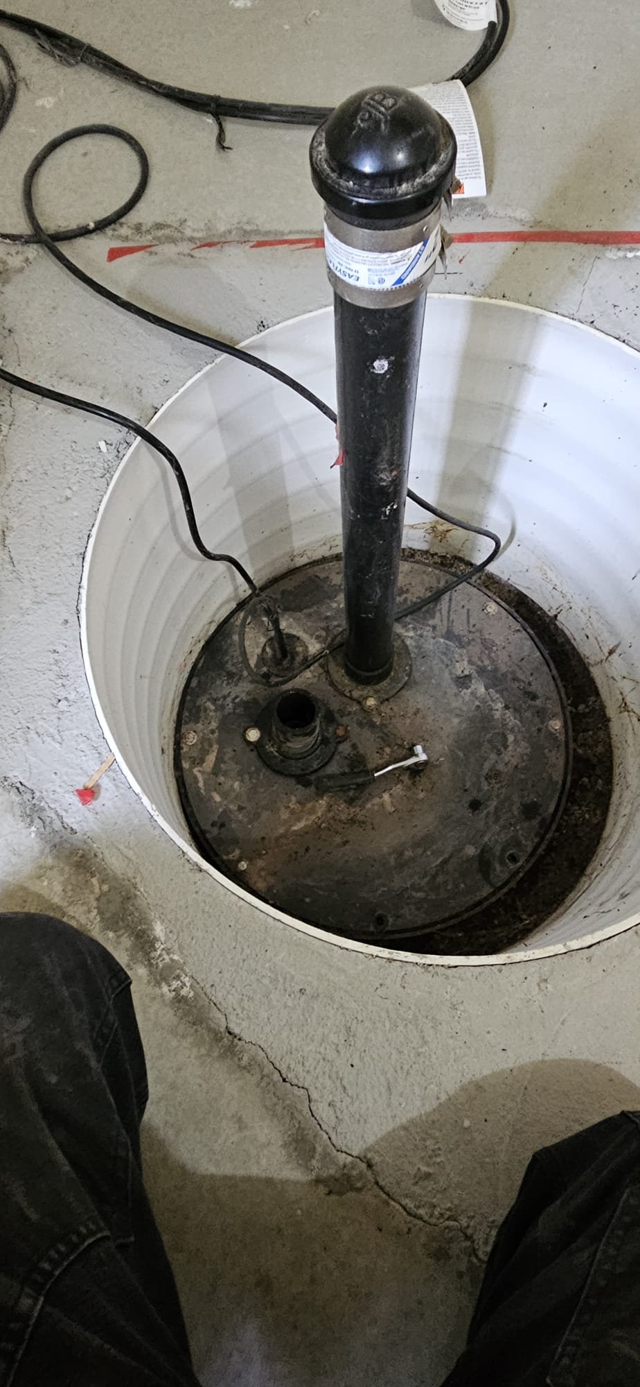 Image depicts commercial sewage backup cleanup diagnosis, emphasizing sewage tank maintenance importance to prevent backups and the availability of insured cleanup services for commercial properties affected by sewage issues.