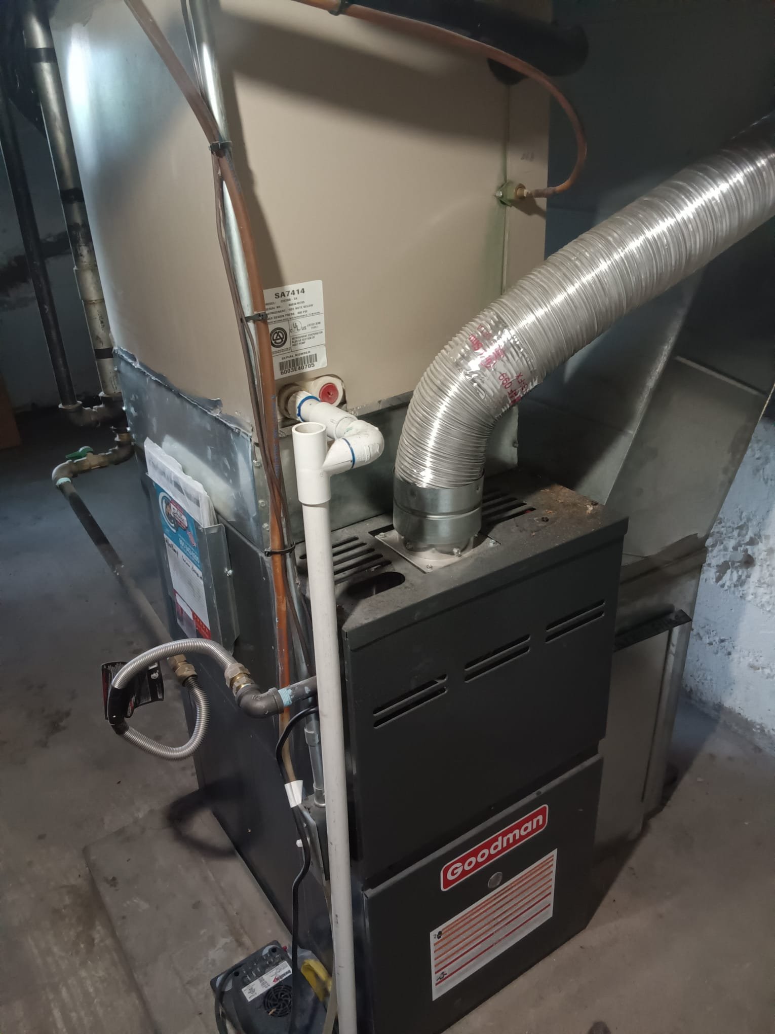 Image depicting air conditioning replacement. A technician installs a new home air conditioner, highlighting the process of upgrading to a more efficient unit. This visual relates to air conditioning replacement cost considerations for homeowners.