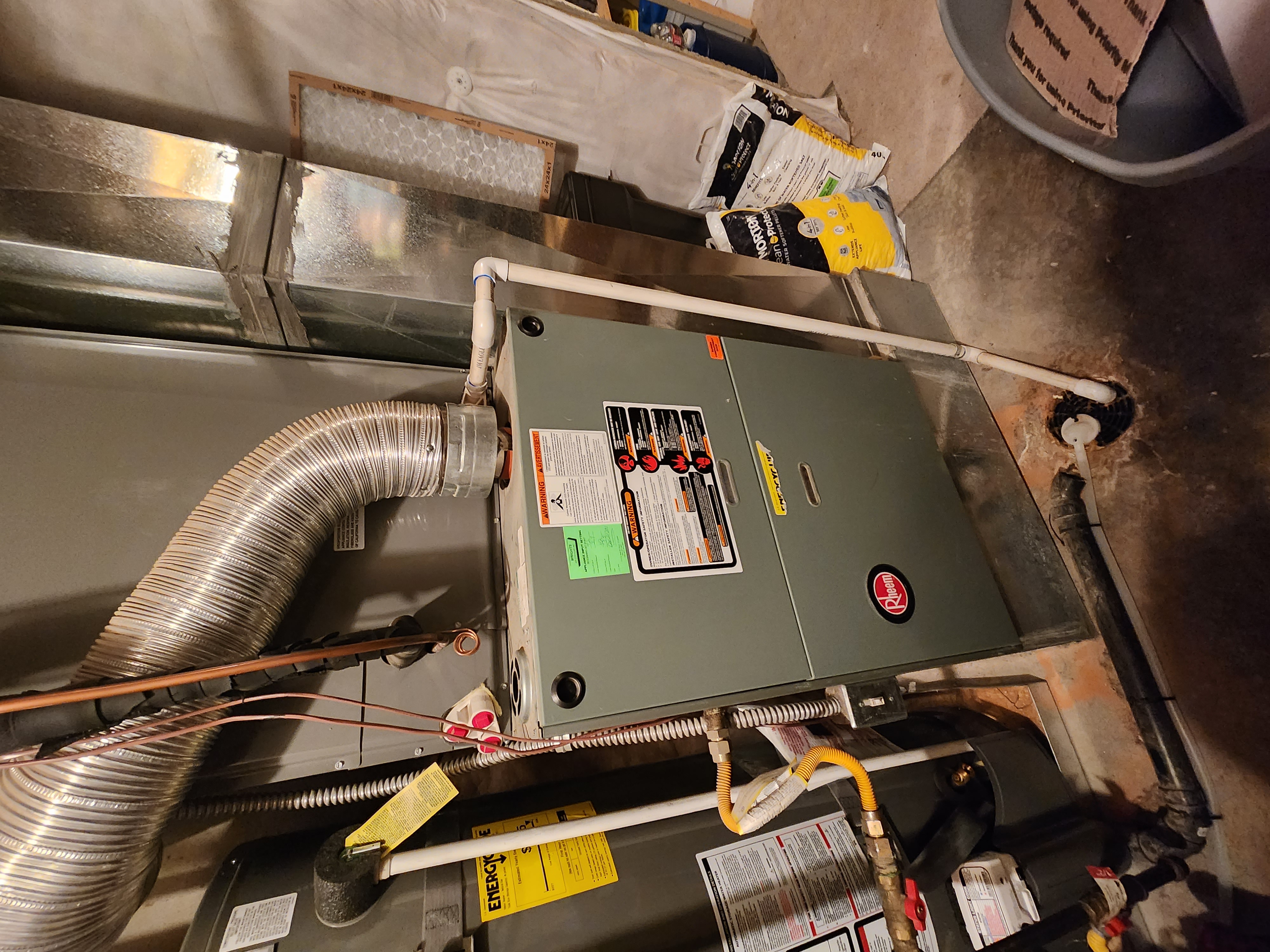 Alt text: A central furnace making a loud rumbling noise during startup. This image relates to central furnace heating system issues and troubleshooting, potentially referencing a Goodman furnace troubleshooting manual for solutions to common problems like loud rumbling noises.