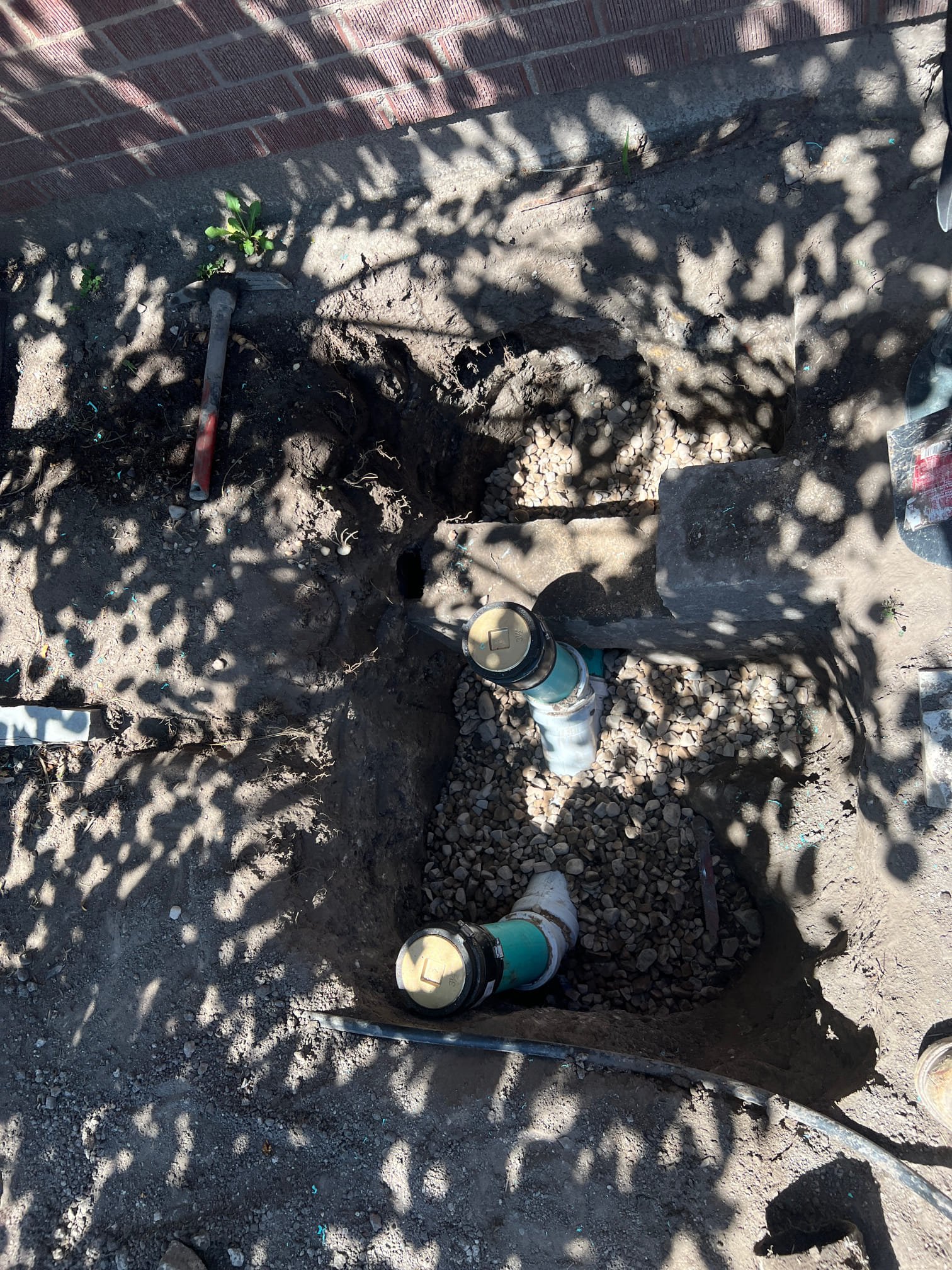 Image depicting water service line repair, possibly involving faucet repair tools and components related to faucet kitchen sink repair. Could show plumbing tools, pipes, or a plumber working on a water line or faucet. Relevant for plumbing services, leak repair, and DIY plumbing projects.