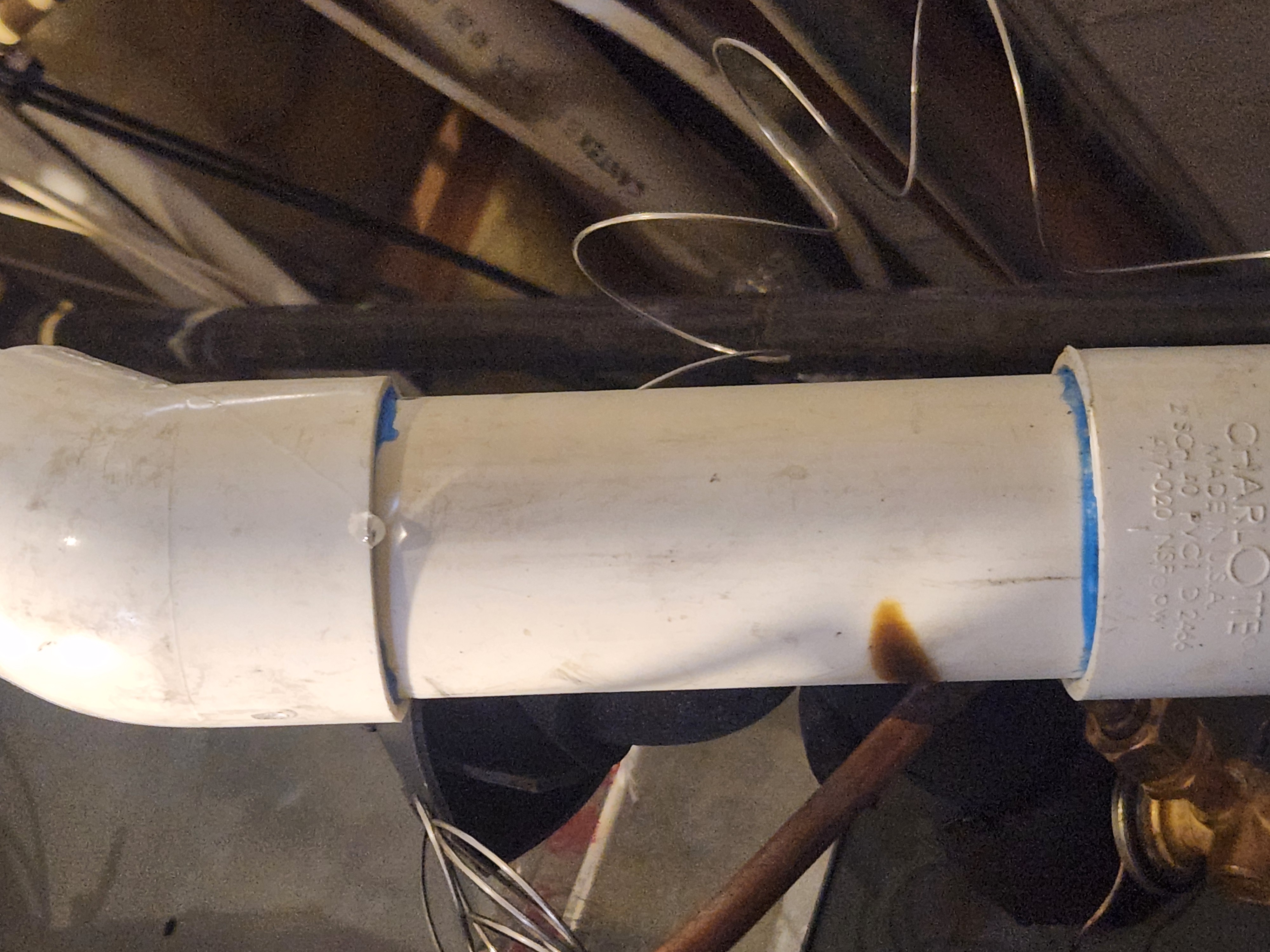 Image depicting a home repair scene. Focus on drywall repair, subtly hinting at water damage odor removal services. Text overlay highlights "Insured Drywall Water Damage Odor Removal" for SEO. A clean water glass or filter component subtly suggests connection to "RO Water Filter Installation", implying comprehensive home solutions.
