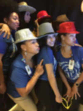 nurses smiling and having fun inside enclosed photo booth at Seton Medical Hospital in Killeen