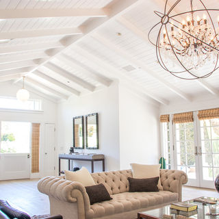 Living room with chandelier and couch  in Montecito home