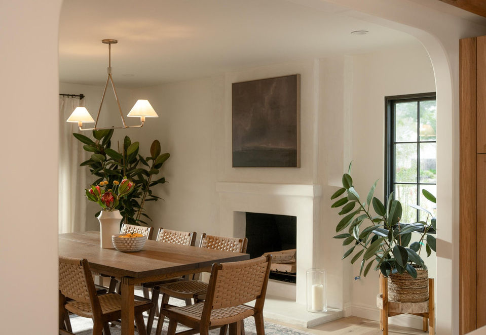 Dining room with fireplace in Spanish Style home in Santa Barbara CA