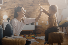 cheerful-mother-giving-highfive-her-small-son-home-min.png