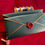 Thumbnail: two wax sealed green letters with gold trim on a red velvet background with a treasure chest in the back