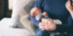 Man Holding Newborn